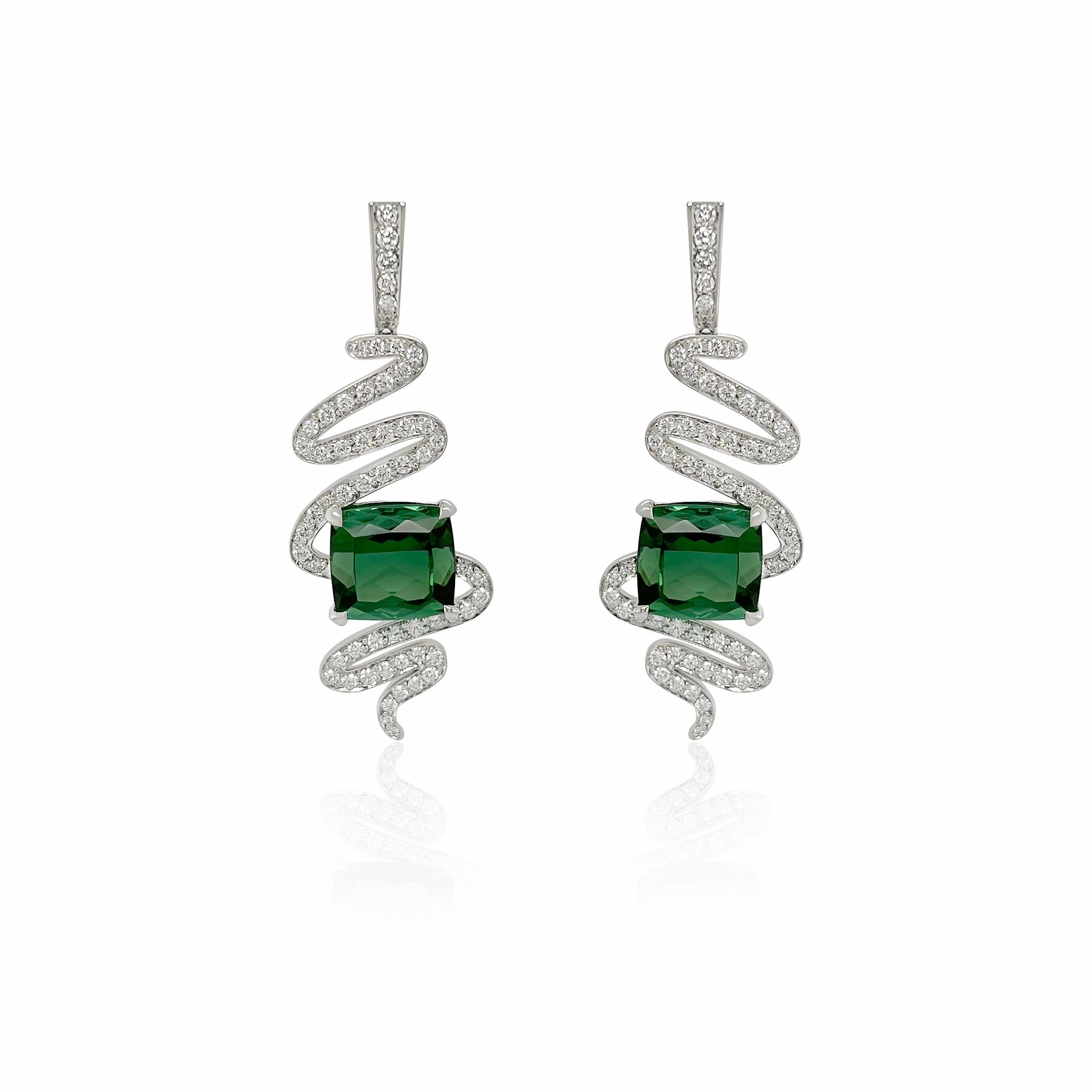 These earrings showcase the breathtaking beauty of vivid Brazilian green tourmalines. These gemstones weight 6.14 cts (10.86 mm x 10.28mm ) and 6.85 cts ( 10.88mm x 10.68 ) and are specially cut making them truly unusual. Their rich, natural color
