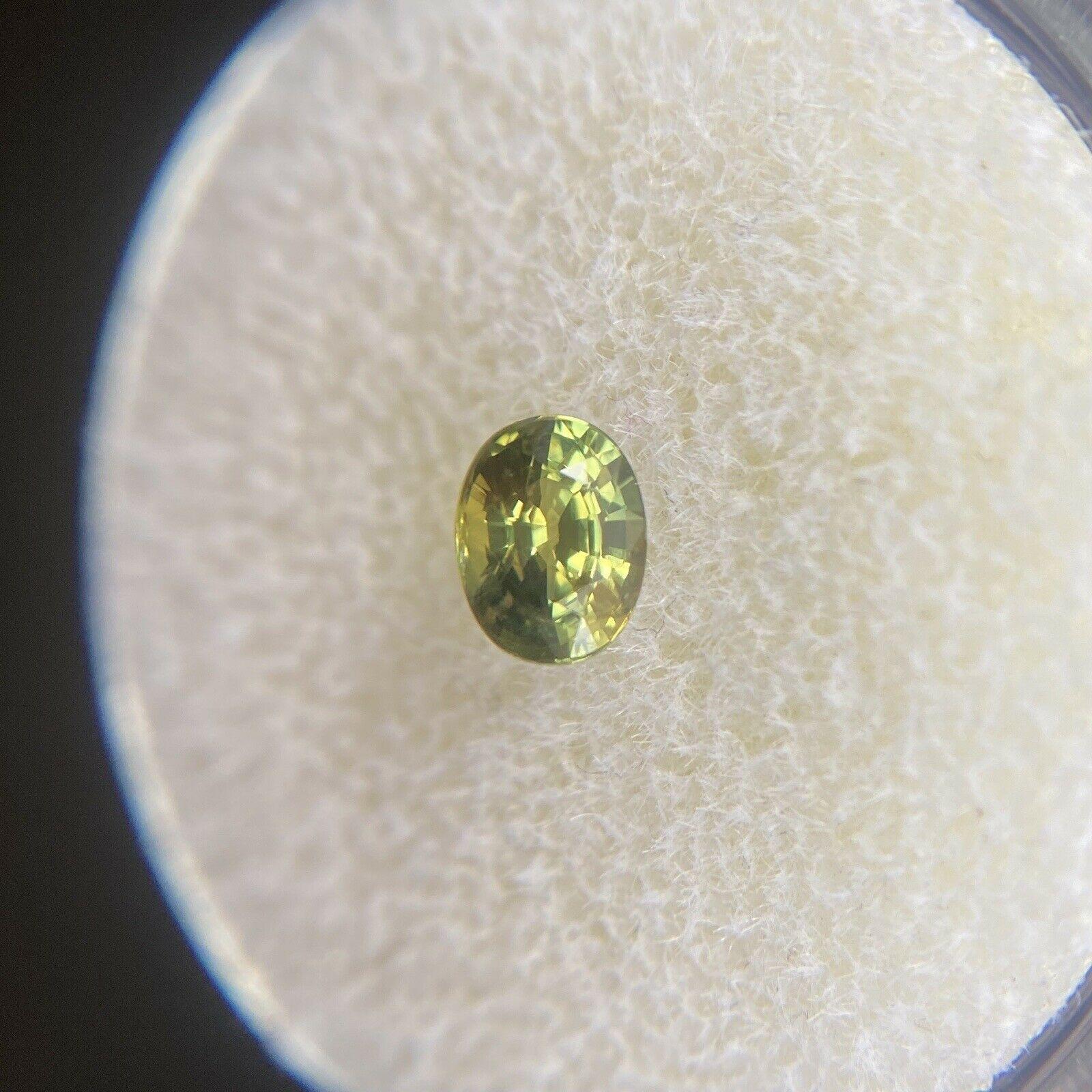 Vivid Green Yellow Untreated Sapphire 0.57ct Australian Oval Cut Gem 5.2 x 4mm

Natural Vivid Green Yellow Sapphire Gemstone. 
0.57 Carat with a beautiful vivid green yellow colour and an excellent oval cut. Also has very good clarity, very clean