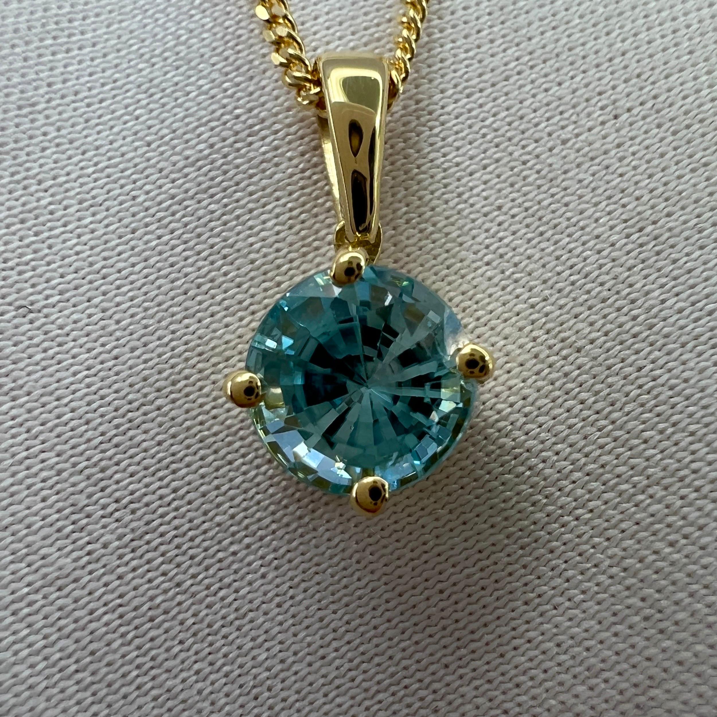 Vivid Neon Blue Natural Zircon Round Cut 18k Yellow Gold Pendant Necklace.

Beautiful natural 1.20 carat blue zircon set in a fine 18k yellow gold solitaire pendant. Stunning blue zircon with a vivid neon blue colour and excellent clarity, very