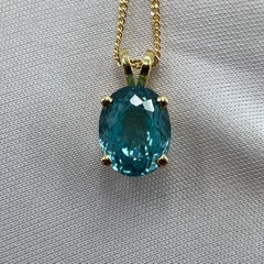Vivid Neon Blue Zircon 3.77 Carat Oval Cut 18k Yellow Gold Pendant Necklace