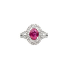 Vivid Oval Ruby Halo Ring with Baguette Diamonds and Split Shank in White Gold