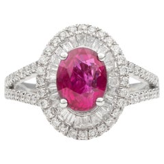 Vivid Oval Ruby Halo Ring with Baguette Diamonds and Split Shank in White Gold