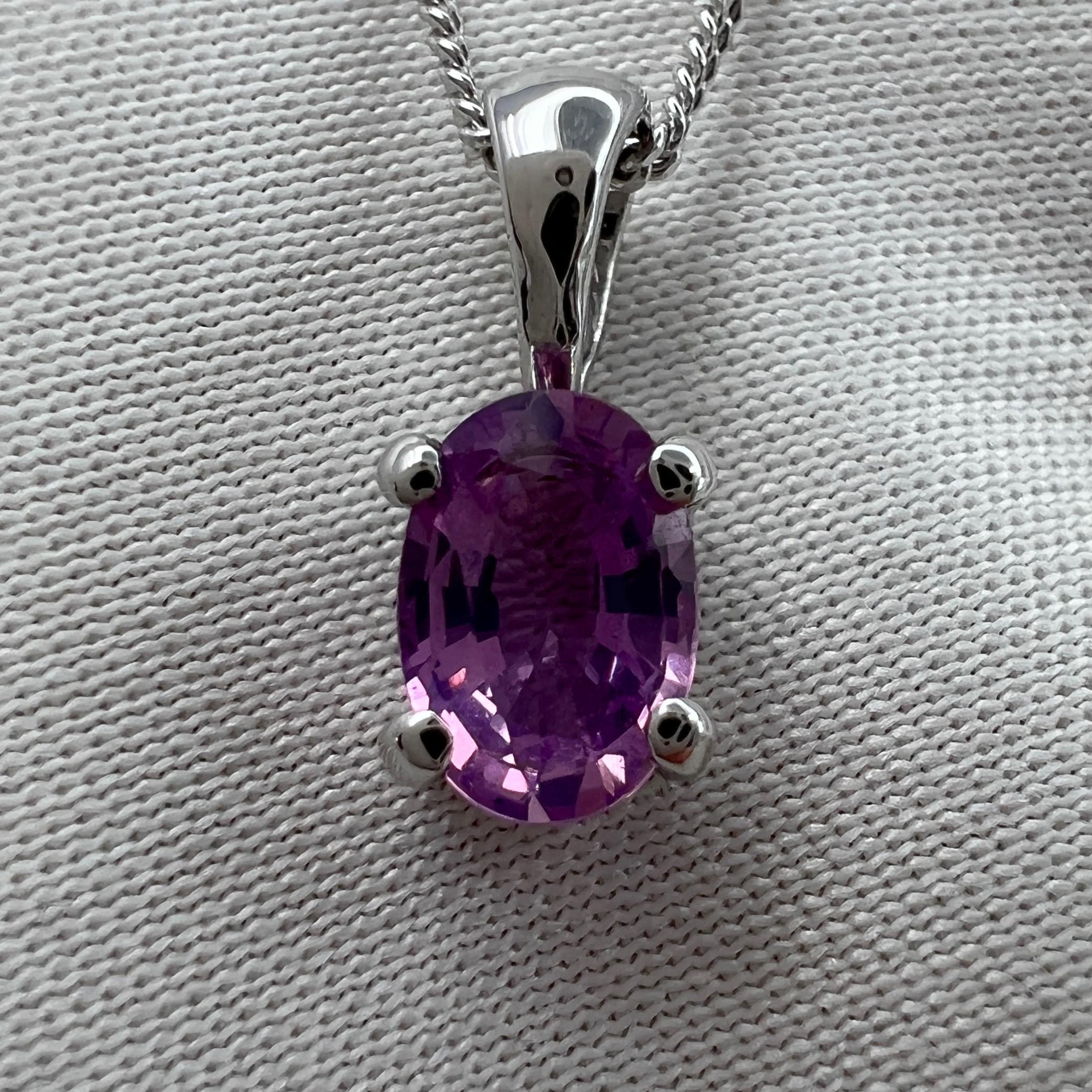 Natural Pink Purple Ceylon Sapphire 18k White Gold Oval Cut Solitaire Pendant Necklace.

0.70 carat sapphire with a vivid purplish pink colour and excellent clarity, very clean stone.
Also has an excellent oval cut, set in a fine 18k white gold