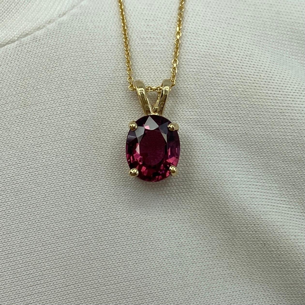 Vivid Pink Red Garnet Solitaire Pendant Necklace.

Beautiful 2.00 carat rhodolite garnet in a fine 14k yellow gold solitaire pendant. This gem has a stunning colour and excellent clarity. A very clean stone.
It also has an excellent oval cut which