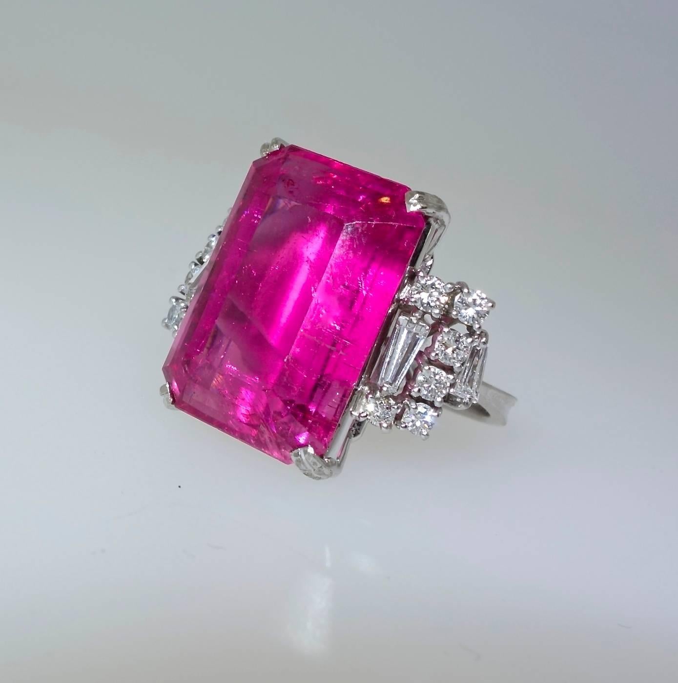The bright - vivid and robust- pink tourmaline weighs 24.47 cts., and is a bright 