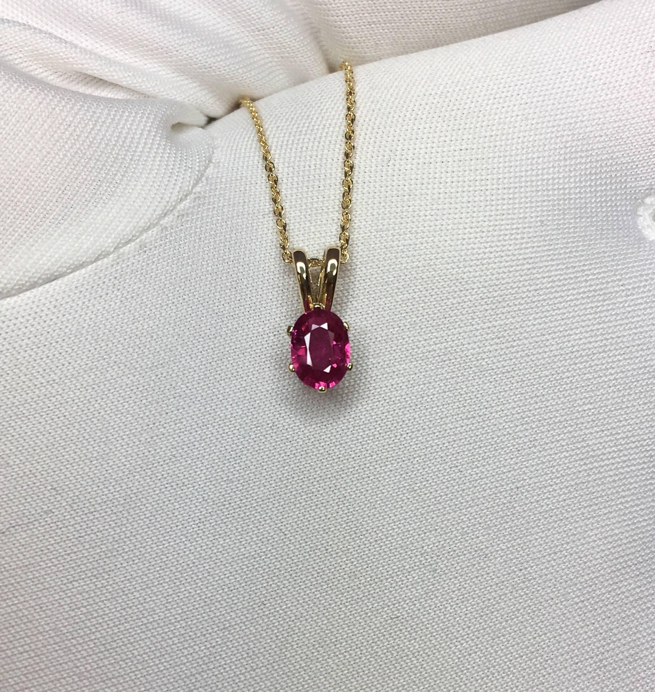 Beautiful natural 0.54ct vivid pinkish red ruby.
Set in a fine 14k yellow gold 6 prong solitaire pendant.

Stunning ruby with a vivid pinkish red colour and excellent clarity, very clean.

It also has an excellent oval cut which shows lots of