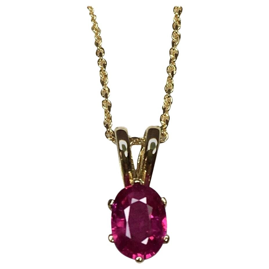Vivid Pinkish Red 0.54 Carat Ruby Solitaire Oval Cut Yellow Gold Pendant