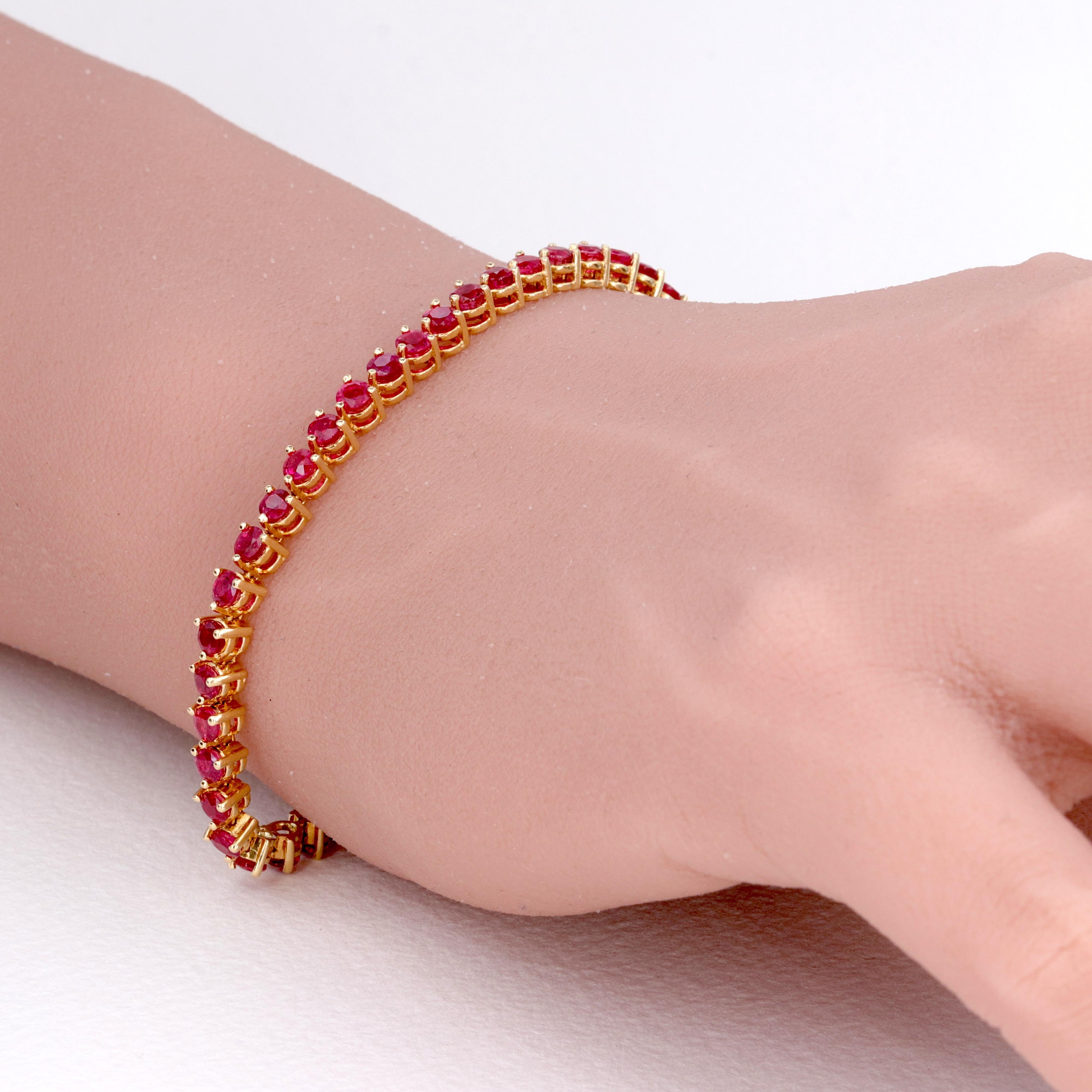 Vivid Red Natural Red Ruby Tennis Bracelet Set in 18 Karat Yellow Gold 

Rubies - 50 Rubies = 5.45 Carats 
Color - Vivid Red 
Clarity - Eye Clean
Metal - 18 Karat Yellow Gold 
Weight - 11.6 Grams
Length - 7.25 Inches