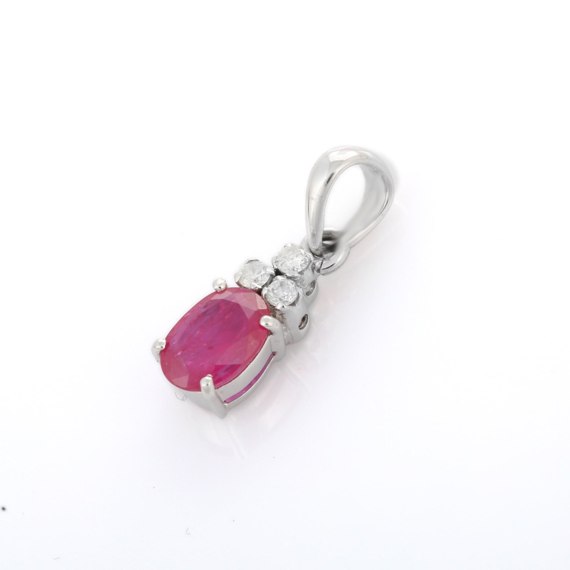 Vivid Oval Ruby Pendant with Diamond in 18K Gold. It has a oval cut ruby with diamonds that completes your look with a decent touch. Pendants are used to wear or gifted to represent love and promises. It's an attractive jewelry piece that goes with