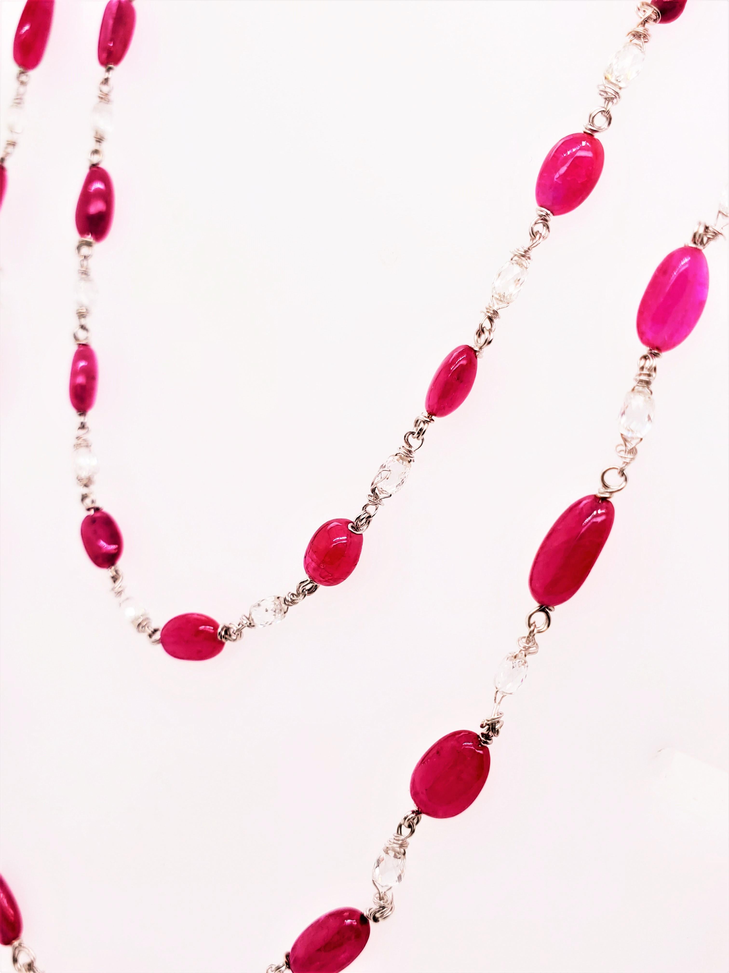Vivid Red Ruby Beads and Diamond Briolette White Gold Necklace :

A scintillating beaded necklace, it features 37 vivid red rubies weighing 41 carat as well as 37 white diamond briolettes weighing 5.14 carat. The rubies are of vivid red colour, with