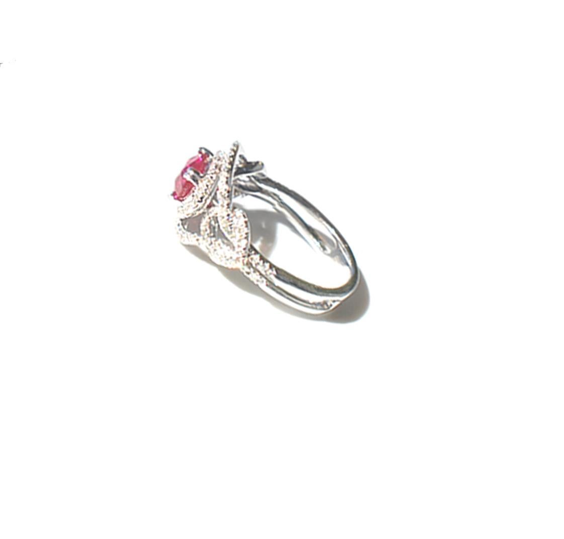 Vivid Red Ruby Diamond Solitaire Ring 2.08 Carat
Gorgeous ruby ring, of vivid red natural color. The ring setting is a halo style measuring .75 wide x .50 inches tall and is set with pave diamonds. Head of ring is 11.60 x 11.40 mm
Ruby is 1.42