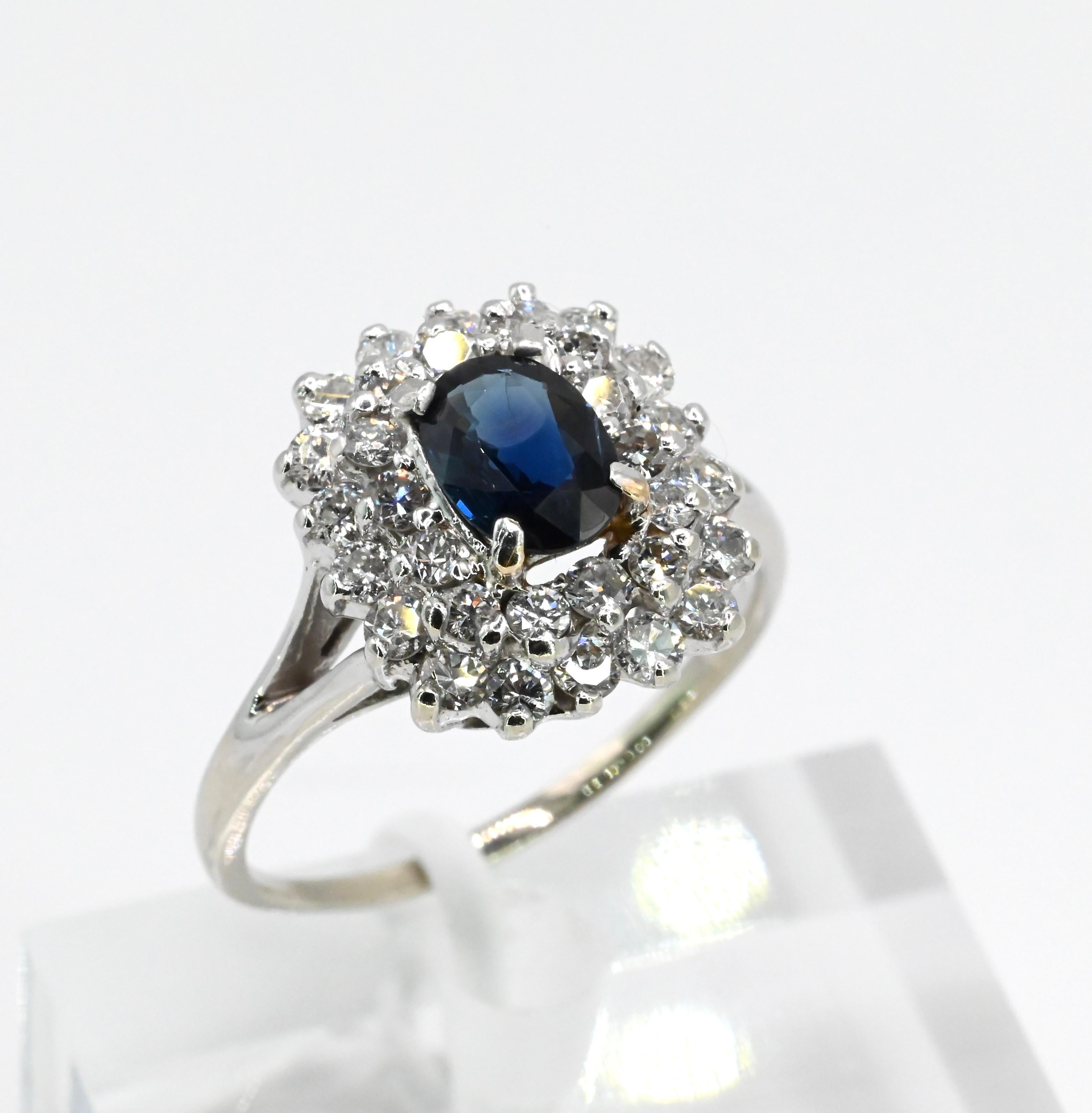 Gorgeous Colorful Deep Blue Sapphire & Diamond 
Ring 14K White Gold 
7 1/2 Size USA 

There are 32 diamond accent stones that are .04 carat each VS Clarity FG color

Sapphire dimensions 
7.07 mm x 5.36 mm x 2.70 mm sapphire Approx 1 carat

3 grams