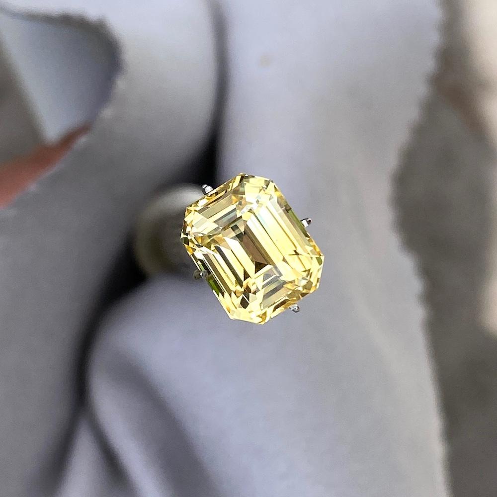 This exquisite over 5 carat vivid yellow sapphire is an emerald cut, natural, and unheated beauty, offering the very best of fine sapphires that Sri Lanka, formerly known as Ceylon has to offer. Cut with the utmost attention to detail, this gemstone