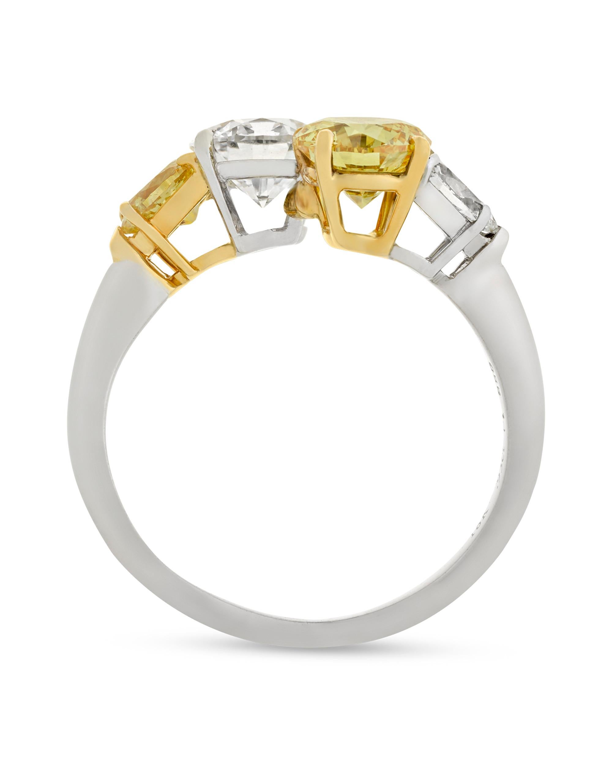 A rare internally flawless white diamond intersects with a natural fancy vivid yellow diamond in this classic bypass ring. Both stones are certified by the Gemological Institute of America (GIA): the 1.01-carat white diamond is classified to be