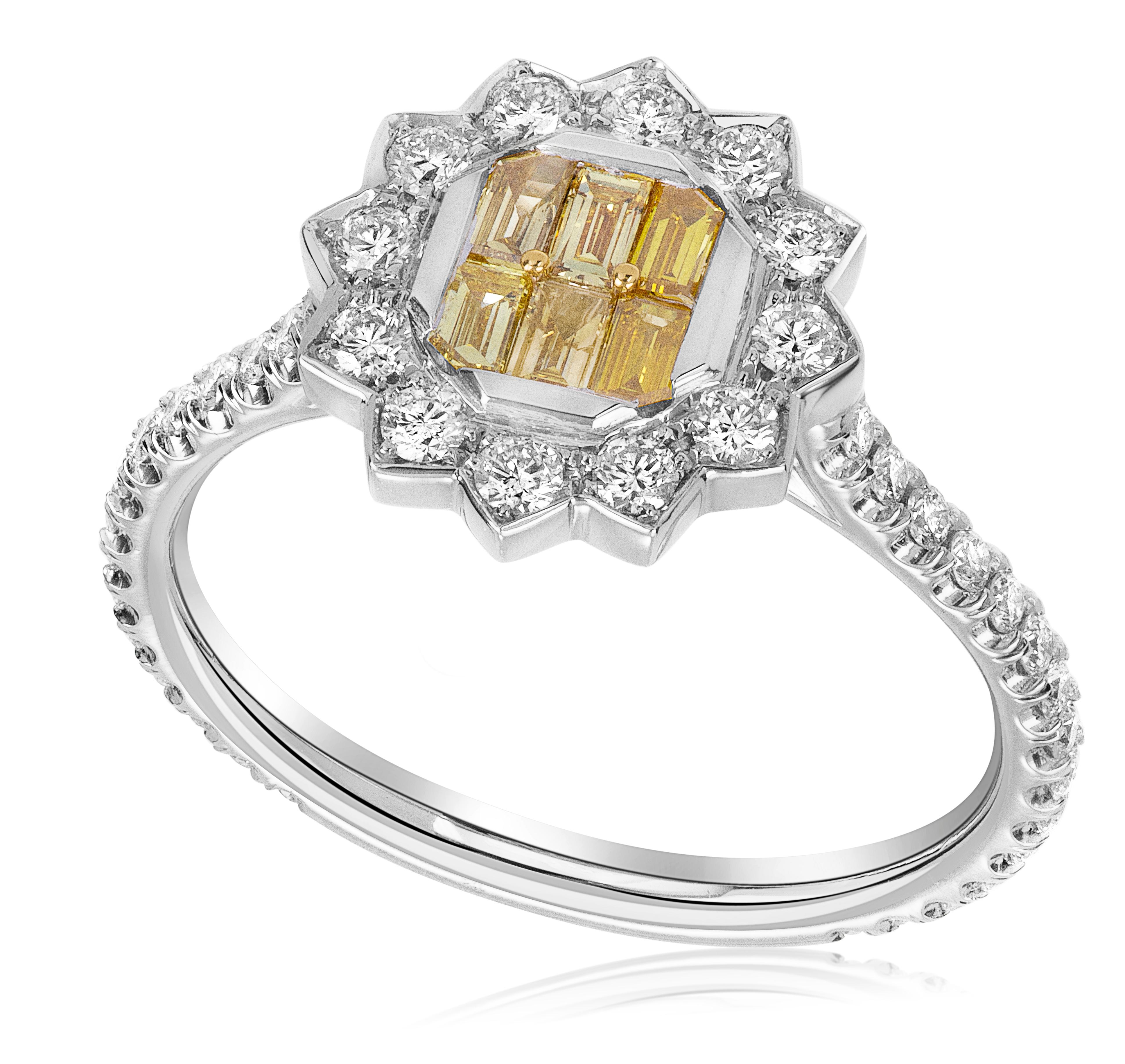 Make a bold and captivating statement with our exquisite yellow baguette ring. This stunning piece features a total of 0.25 carats of fancy vivid yellow diamonds, showcasing their vibrant and intense yellow color. The baguette-cut diamonds are