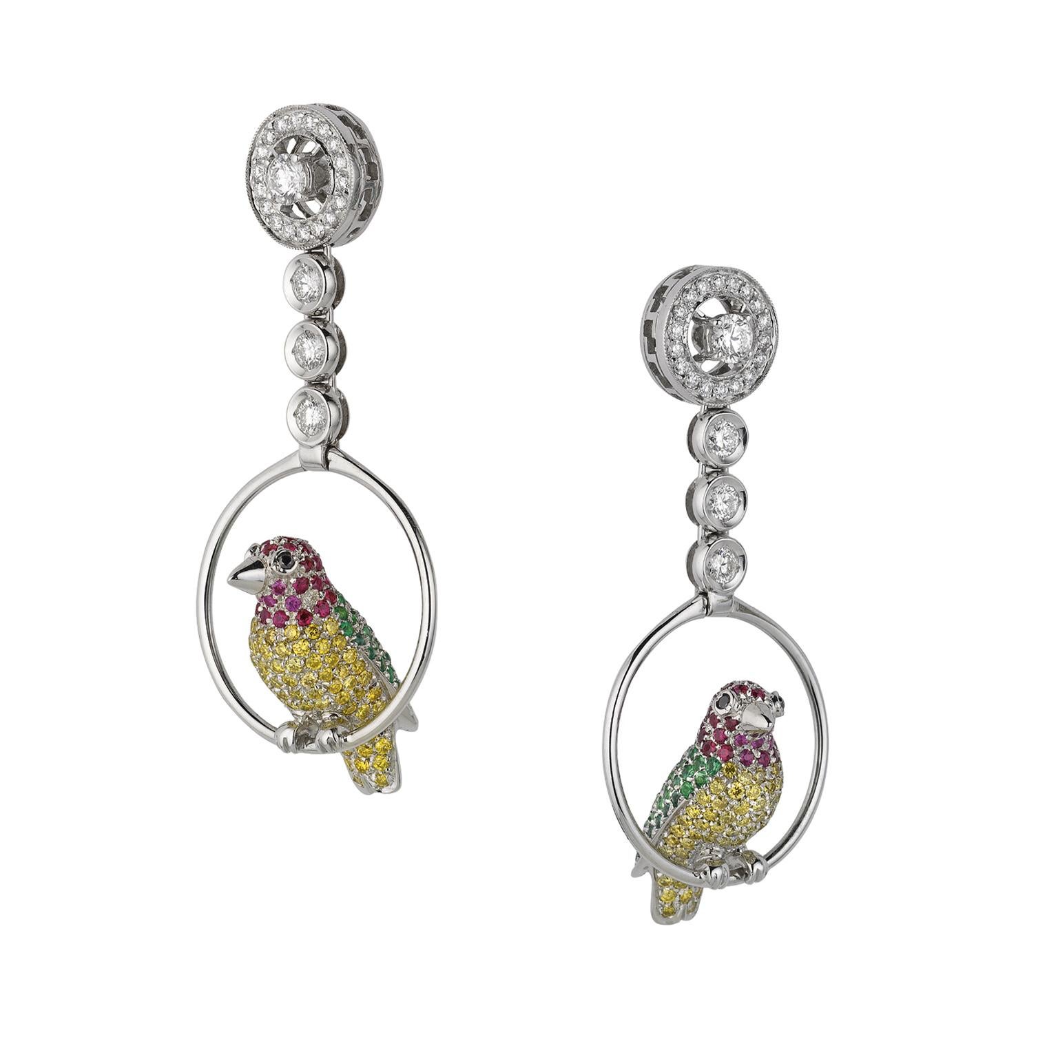 Vivid Yellow White Black Diamond Ruby Emerald 18 Karat Gold Birds Drop Earrings

These beautiful earrings have a part on the top, very classical. A disk with a row along the circumference of little diamonds and another one of ct 0.18 in its center.