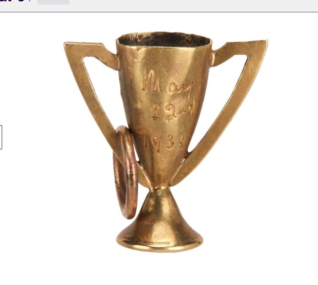 Vivien Leigh's gift to Sir Lawrence Olivier, this extraordinary piece of Hollywood and Theater History is a 14 Karat Gold Loving Cup Pendant Charm engraved in Vivien Leigh's handwriting, 