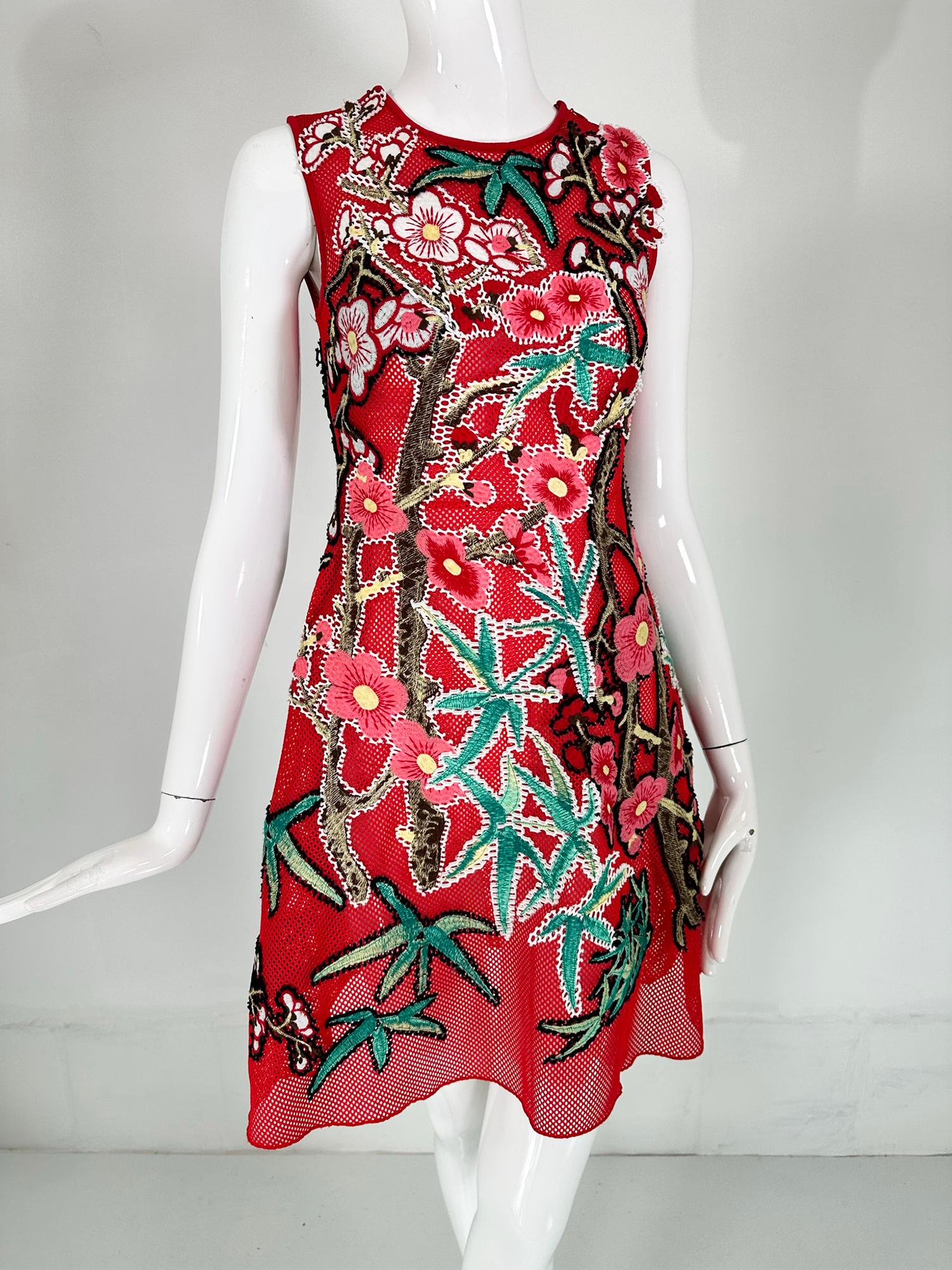 Vivienne Tam abstract red applique mesh dress XS. Jewel neck, sleeveless dress of open red mesh that is appliqued with abstract shapes that may remind you of star fish & and flowers. Bright & colourful the dress is a little work of art. Fitted