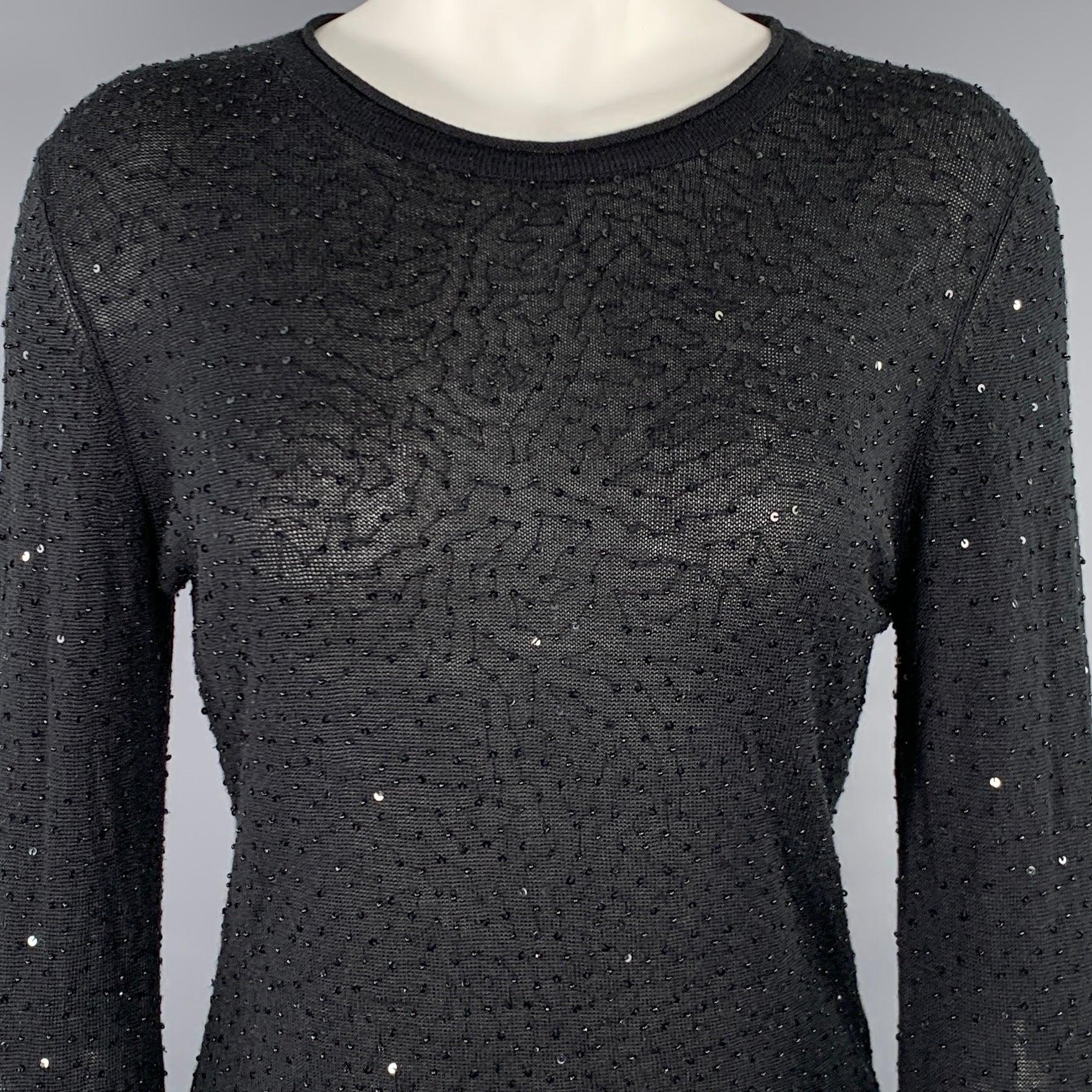 VIVIENNE TAM pullover
in a black silk cashmere blend knit featuring an all over sequined design, long sleeves, and crew neck.Very Good Pre-Owned Condition. Minor signs of wear. 

Marked:   2 

Measurements: 
 
Shoulder: 16.5 inches  Bust: 35 inches 