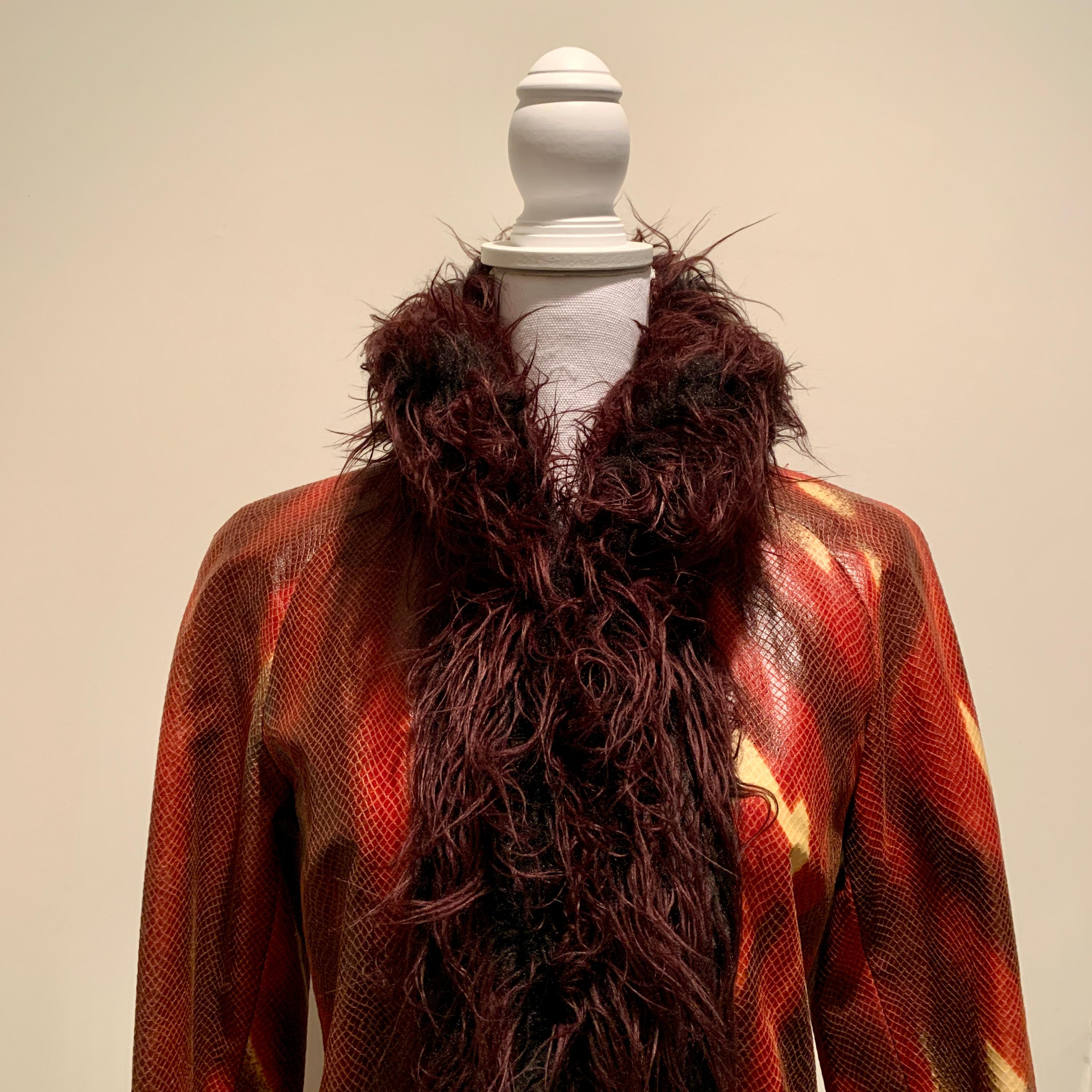 This is IT! A super-cool, show-stopping, early 1990s, Vivienne Tam Faux snakeskin textured coat with a faux fur finished collar. 

Sewn in a polyester fabric with coated PVC dots, the snakeskin textured fabric has a flame-like design in brown,