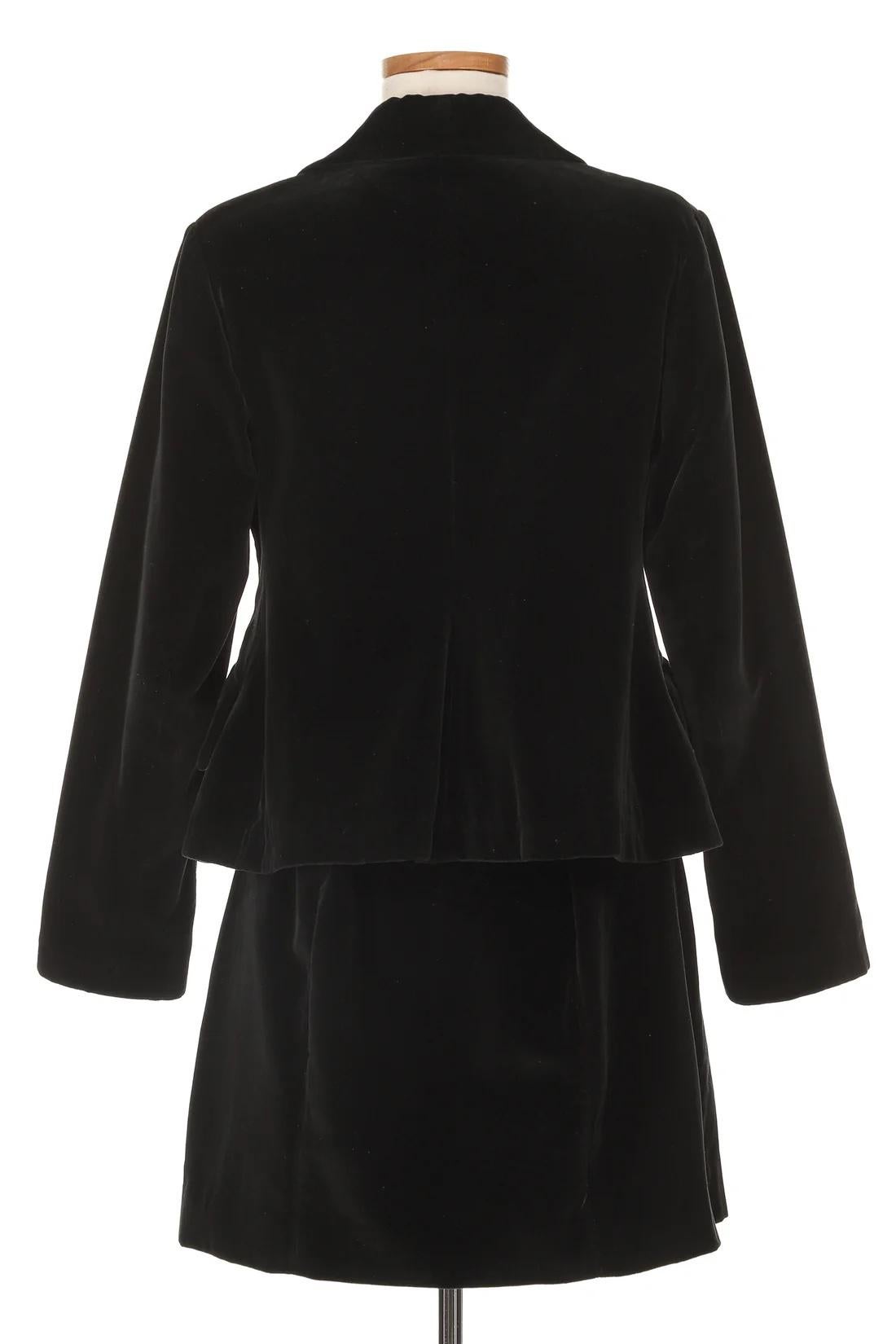 VINTAGE GRACE NY

Vintage Vivienne Westwood Velvet Skirt Suit
Circa 1990's. Gorgeous black velvet double-breasted jacket adorned with iconic logo buttons and matching mini skirt with hidden back zipper closure. A classic Vivienne Westwood design