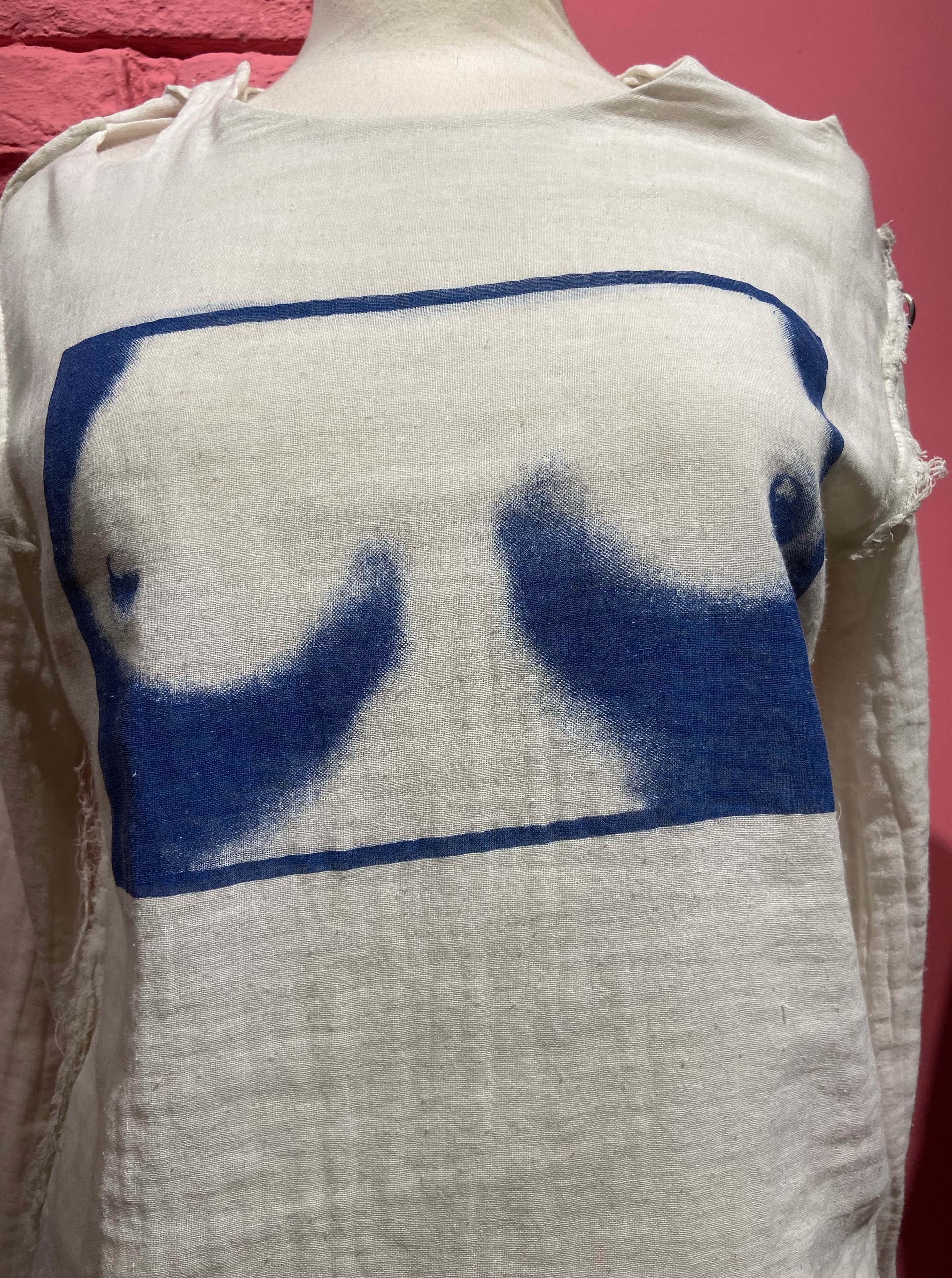 Vivienne Westwood and Malcolm McLaren late 1970's 'Tits' Seditionaries top. Features hardware buckles, frayed edges, rare print and cut out detailing. In great vintage condition.

Brand: Vivienne Westwood
Color: White
Size: UK 8
1970's
Modern Size: