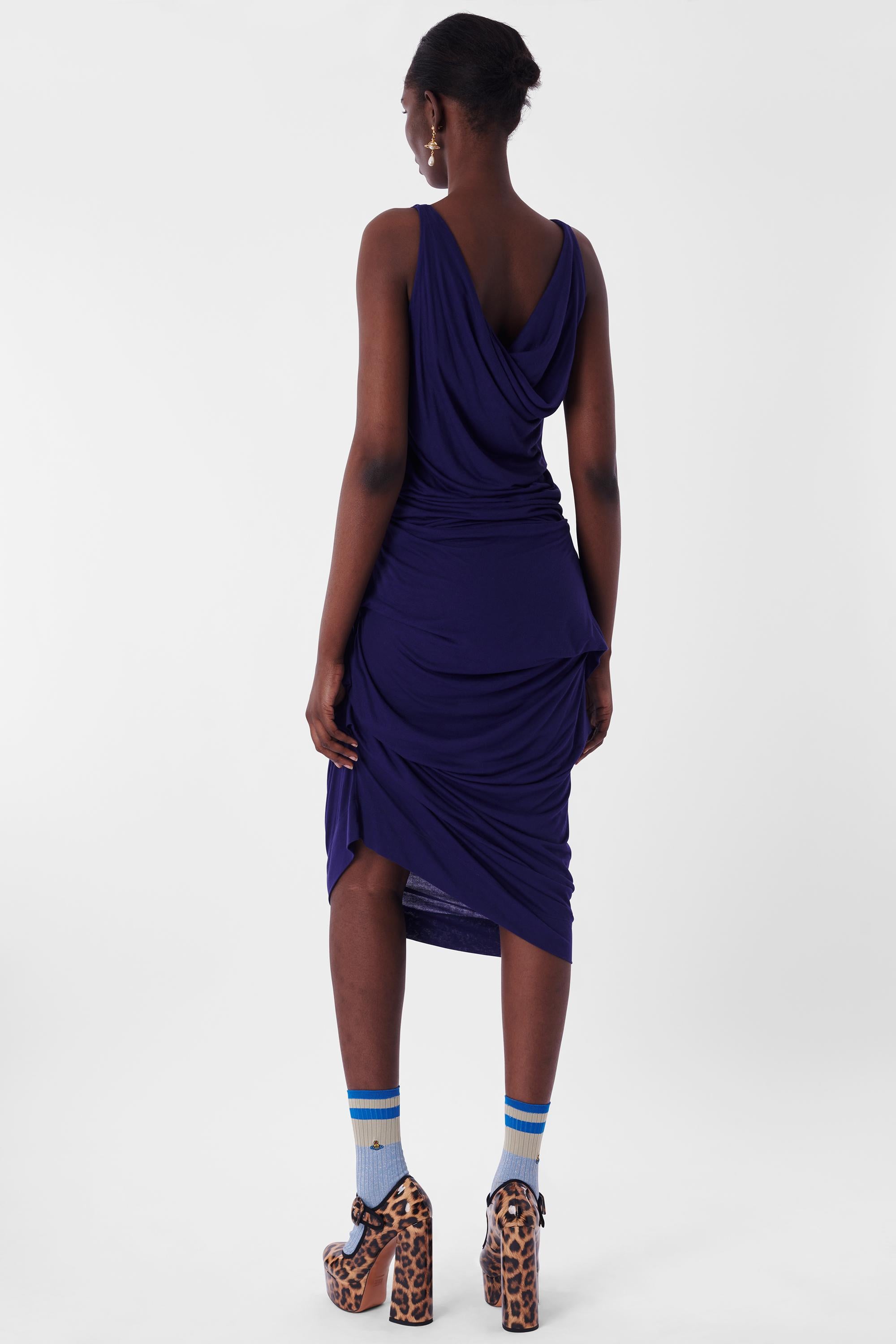 Vivienne Westwood Anglomania Blue Draped Dress. Features Draped scoop neckline and midi length.

Label size: Medium
Modern size: UK: 10, US: 4 - 6, EU: 38
Measurements when laid flat: length: 48 inches, bust: 18 inches, waist: 16.5 inches