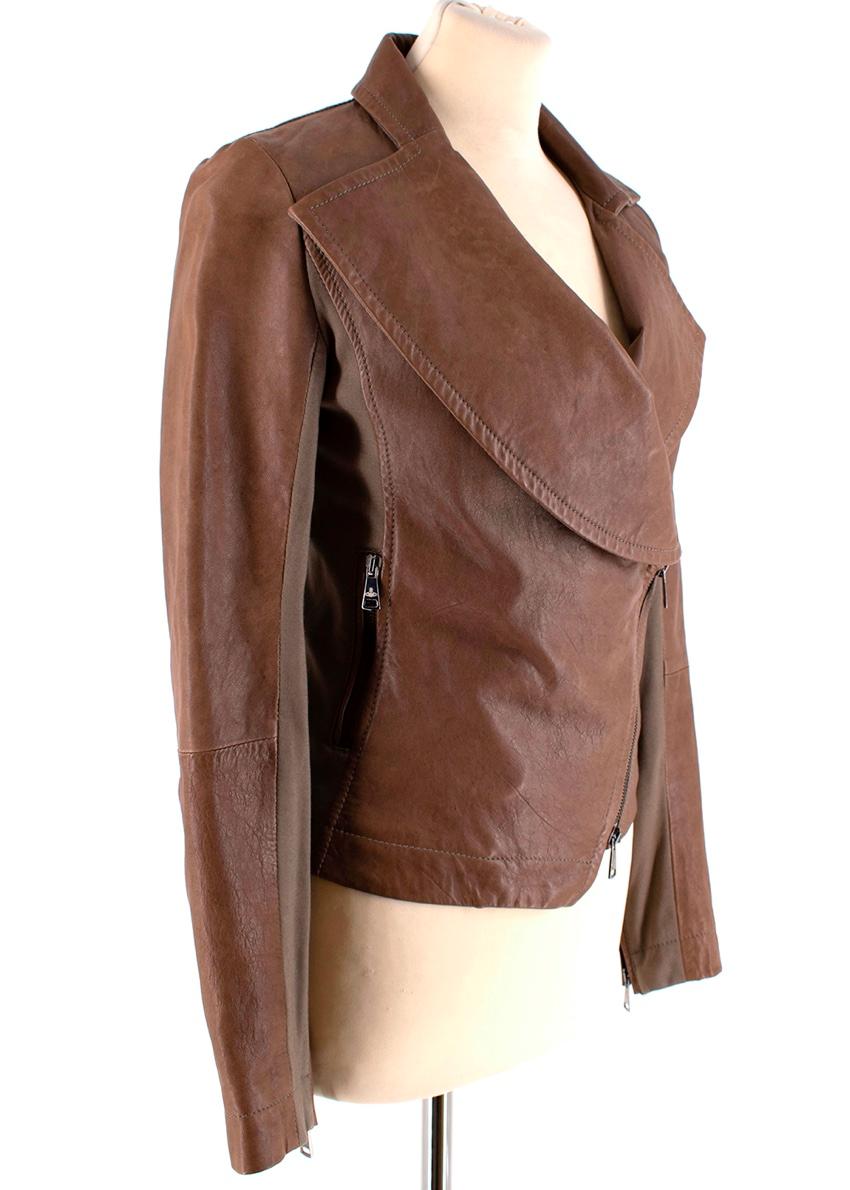 Vivienne Westwood Anglomania Brown Leather Asymmetric Biker Jacket

-Luxurious soft leather 
-Asymmetric details to the lapel and hem
-Silver logo hardware 
-Jersey side panels 
-Zip fastening to the front 
-Full branded lining 
-2 pockets to the