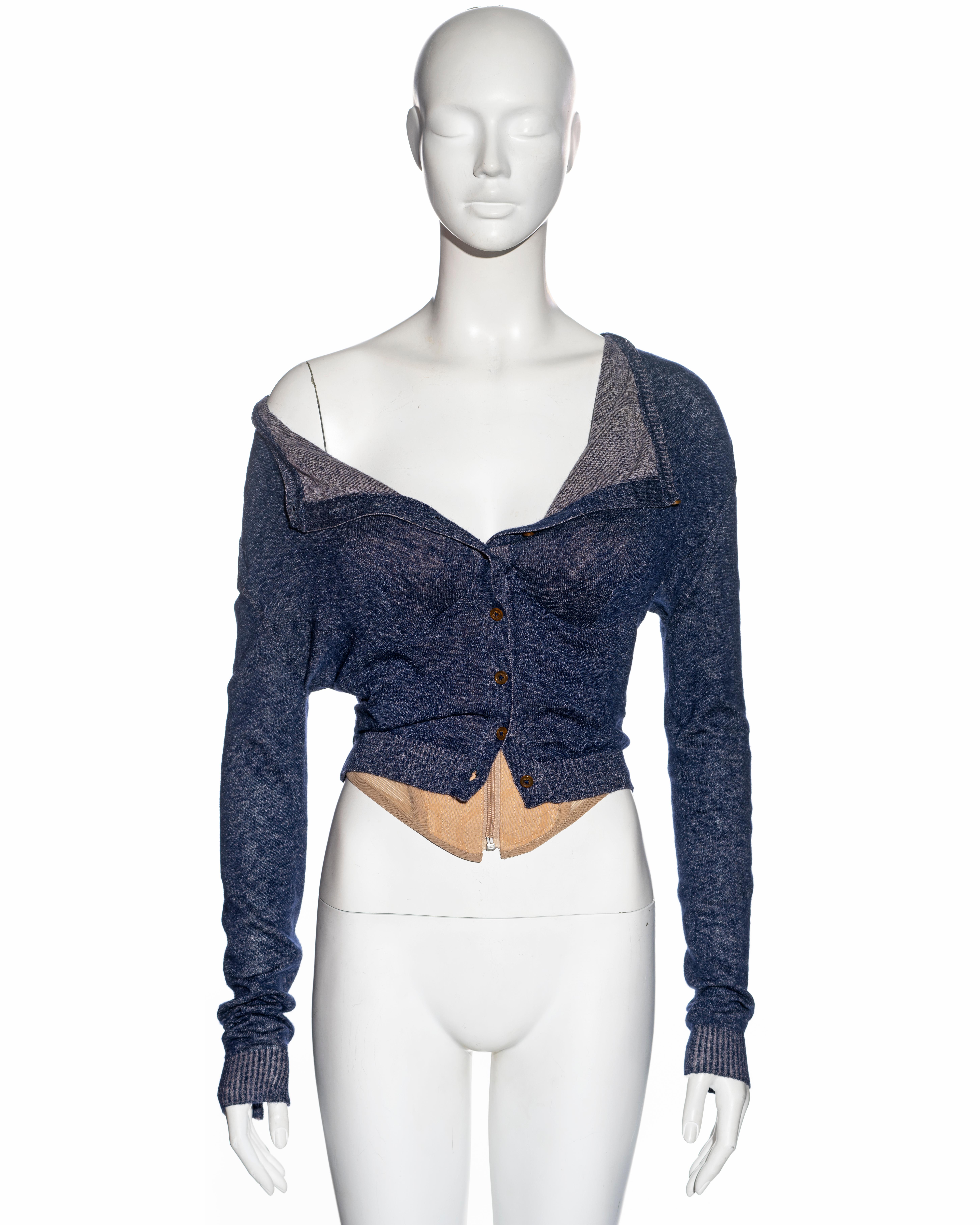 ▪ Vivienne Westwood 'Big Boobs' cardigan corset
▪ Fall-Winter 2008
▪ Nude corset with exaggerated padded bra
▪ Zip closure at the centre front
▪ Attached blue cardigan with straight neckline 
▪ Size: Small

All photographs in this listing EXCLUDING