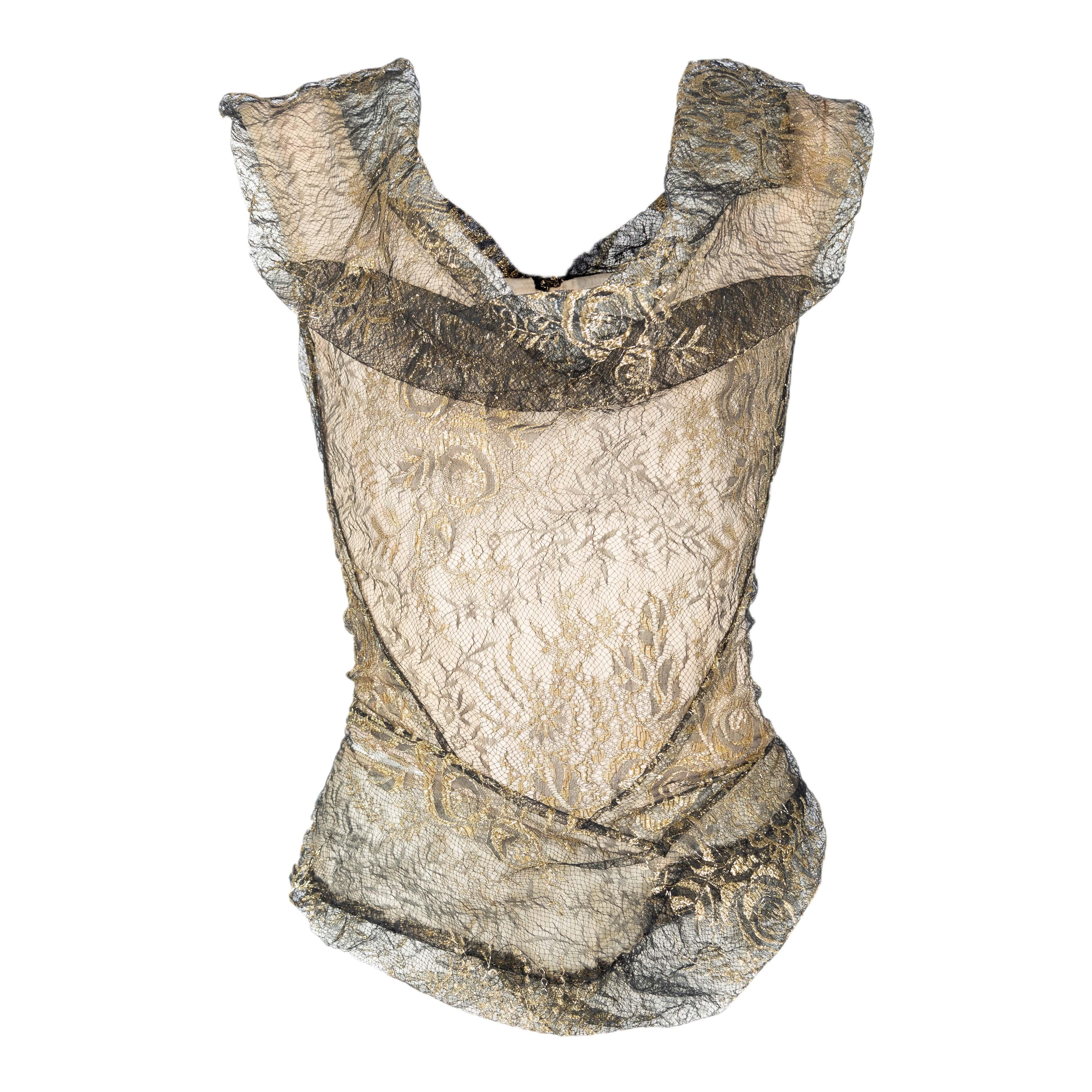 Vivienne Westwood Lace Corset from 2002 Nymphs Collection. It is a rare and unique piece with a tight-fitting silhouette that flares out slightly at the hips. The lace gathering on the front falls to give an accentuated look around the neckline. The