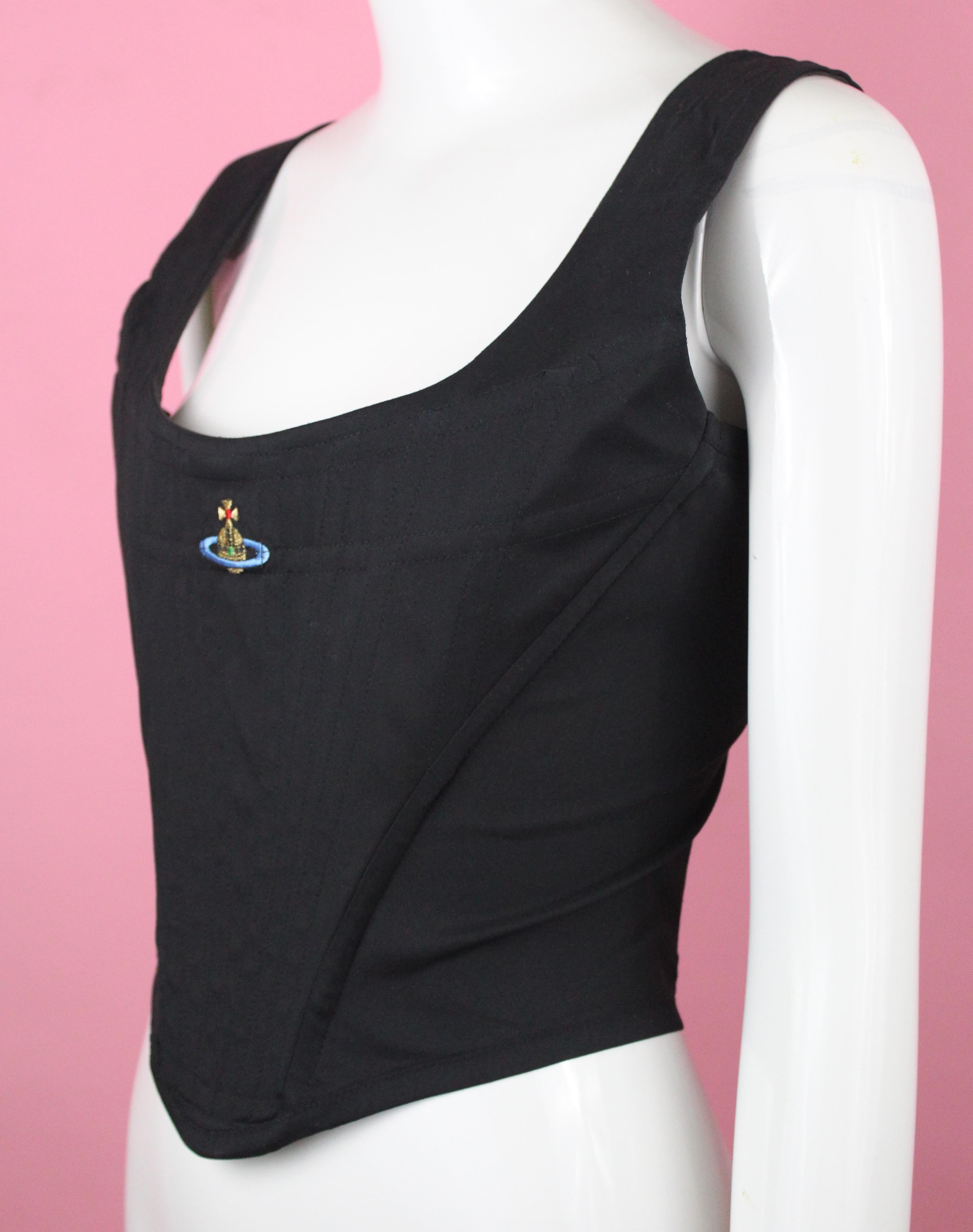-Gorgeous corset from Vivienne Westwood, has iconic  orb logo on the breast.
-Black fabric has stretch
-Made in Italy
-Sized Italian 44, corresponds with an 8 US

Approximate Measurements 
-Total length: 17