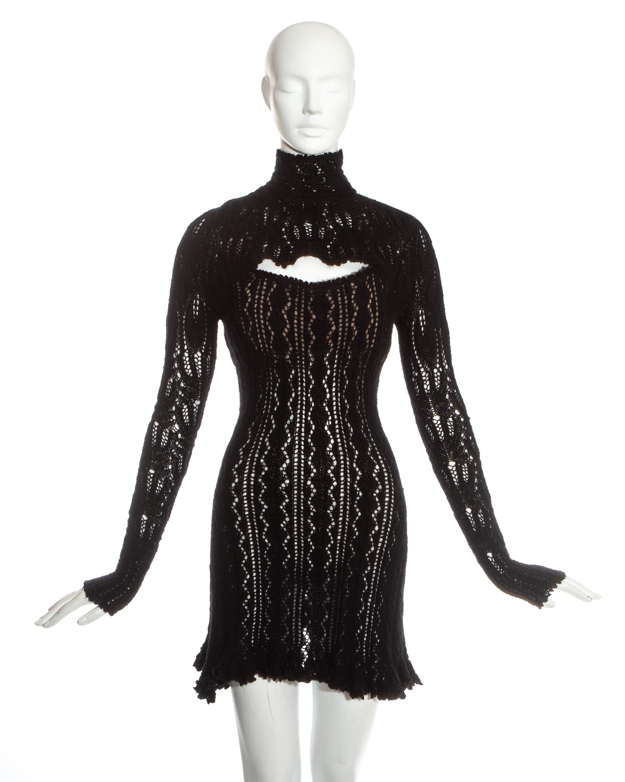 Vivienne Westwood. Black crochet knit mini dress. Built in boned corset, cut out on the bust, flared hemline and turtle neck. 

Fall-Winter 1993