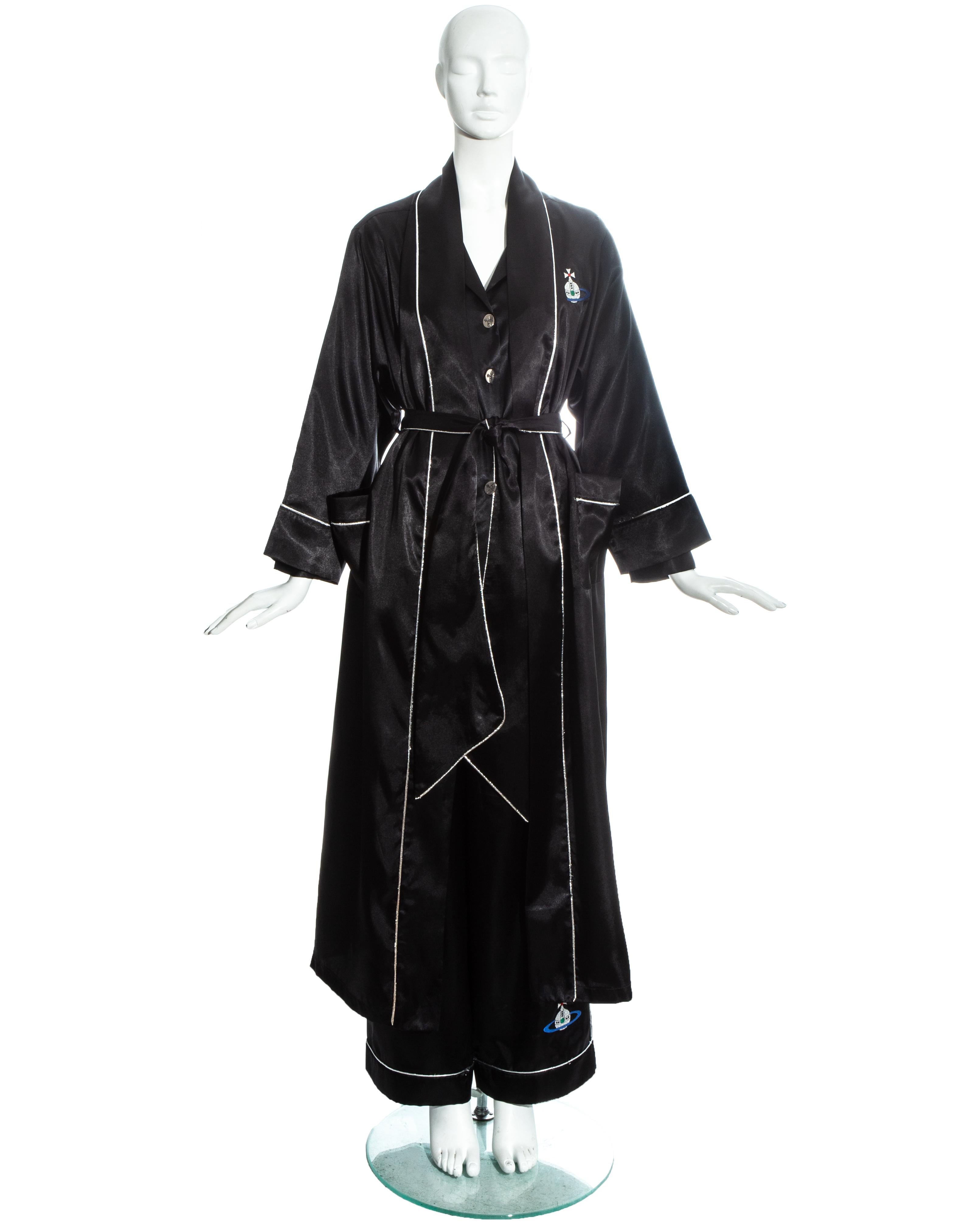 Vivienne Westwood black polyester 3 piece pyjama suit with three large embroidered orbs and silver lurex piping. Loose fit robe with matching belt and two front pockets, loose fit blouse with silver metal orb button closures and wide leg pants with
