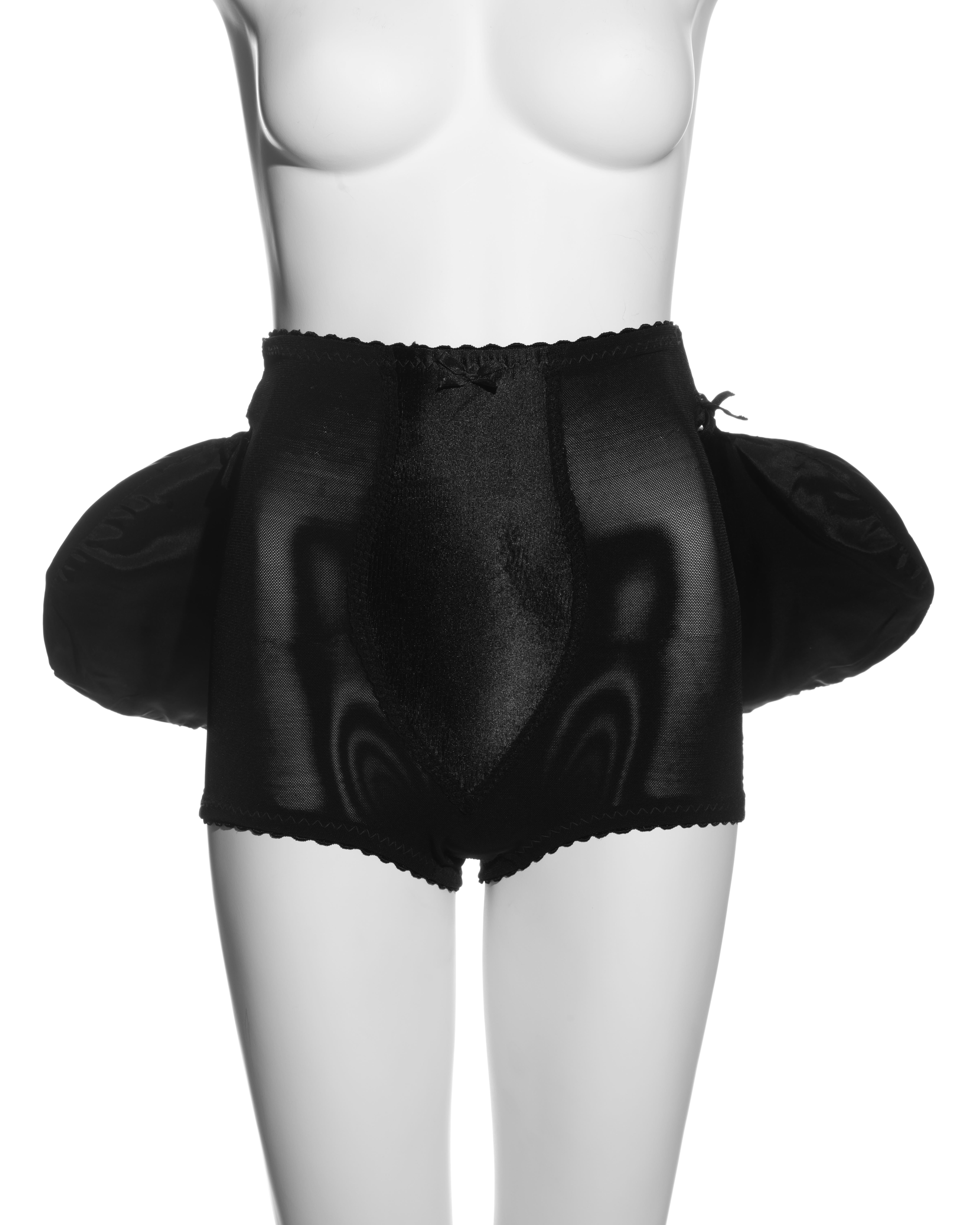 ▪ Vivienne Westwood black panties and bustle set
▪ Power mesh and satin 
▪ Bustle attached with ribbon ties 
▪ Scalloped trim 
▪ Labelled 'One Size' 
▪ Spring-Summer 1995