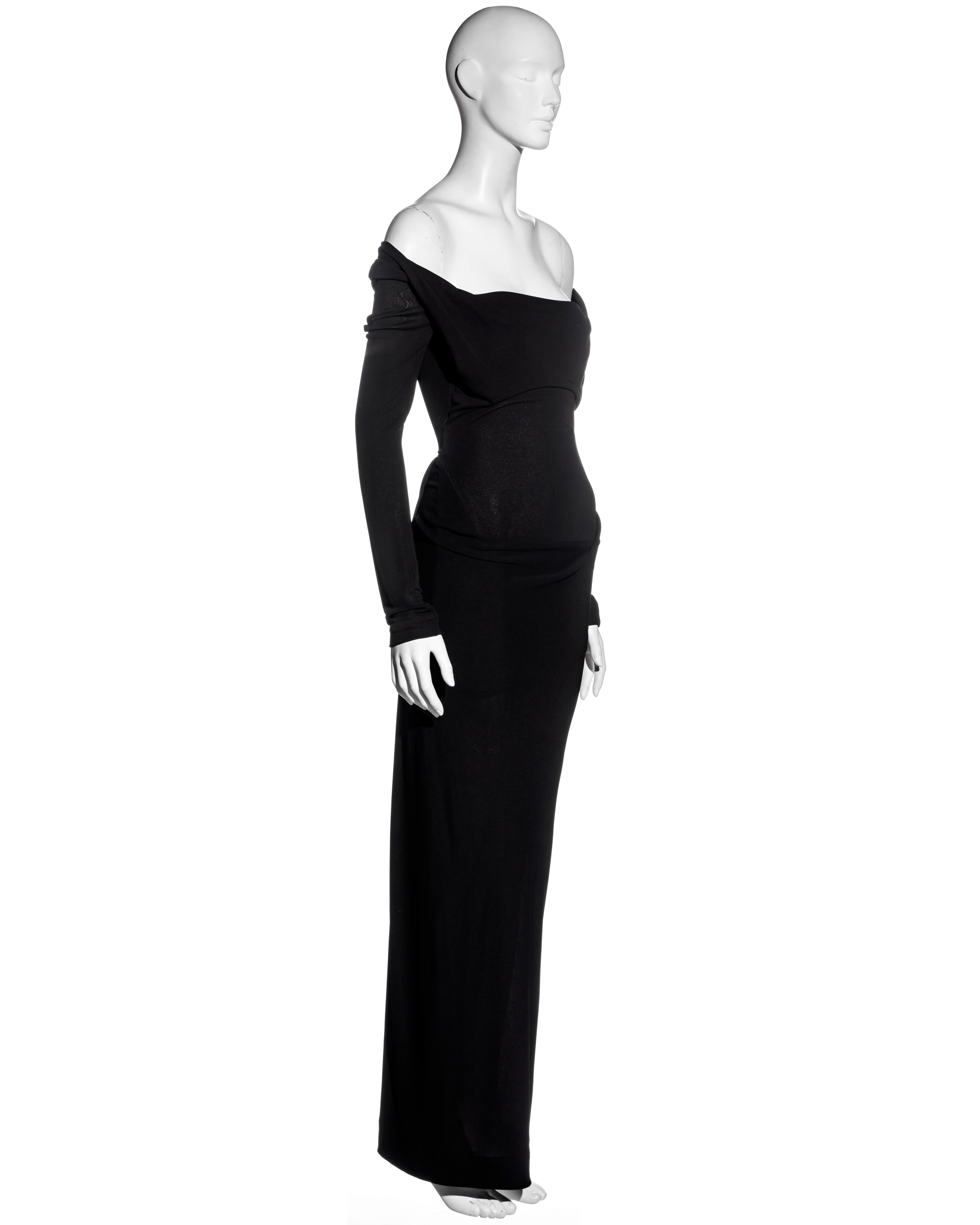 ▪ Vivienne Westwood black rayon evening maxi dress
▪ Off-shoulder 
▪ Cowl neck 
▪ Long fitted sleeves 
▪ Full-length skirt with draped detail at the hips 
▪ Diagonal concealed zipper at the side seam
▪ UK 10 
▪ Fall-Winter 1997
▪ 100% Rayon