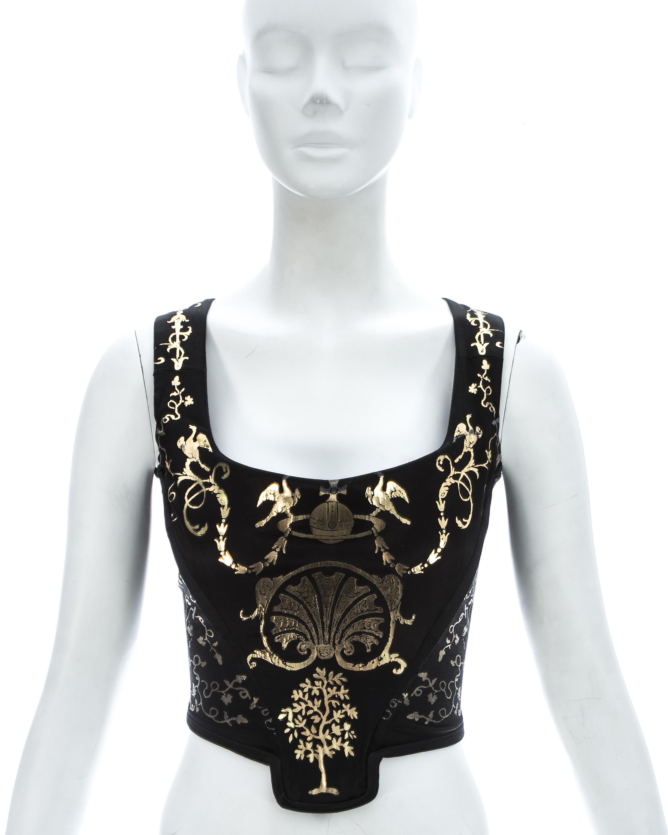 Vivienne Westwood black satin corset with metallic gold applied decoration of classical figures and motifs, and internal boning; designed to chinch the waist and push the breasts up.

'Portrait Collection' Fall-Winter 1990