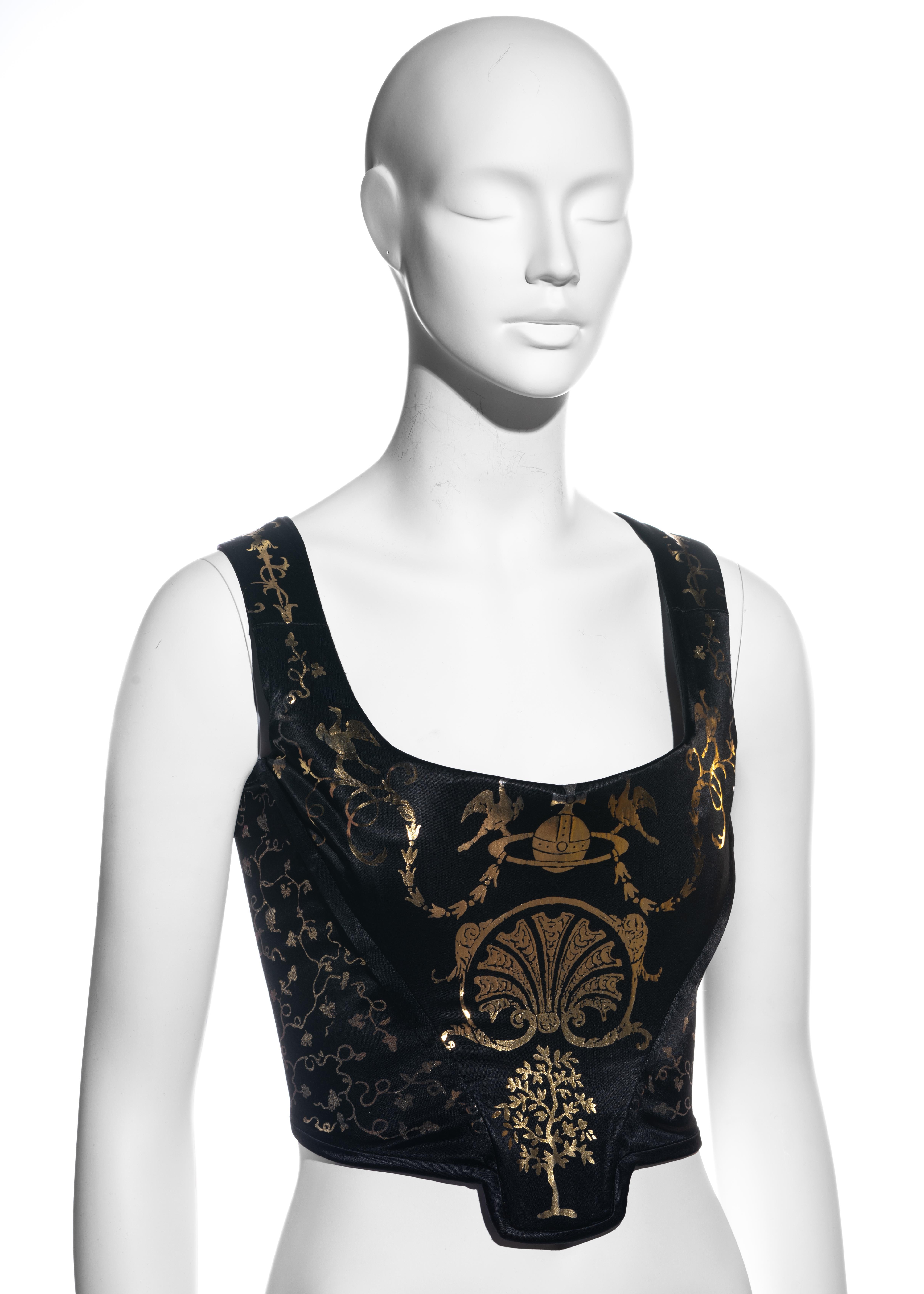 ▪ Vivienne Westwood black satin corset top
▪ Metallic gold classical figures and motifs inspired by furniture jeweler, André-Charles Boulle
▪ Internal boning; designed to cinch the waist and push the breasts up 
▪ Back zip fastening 
▪ FR 42 - UK 14
