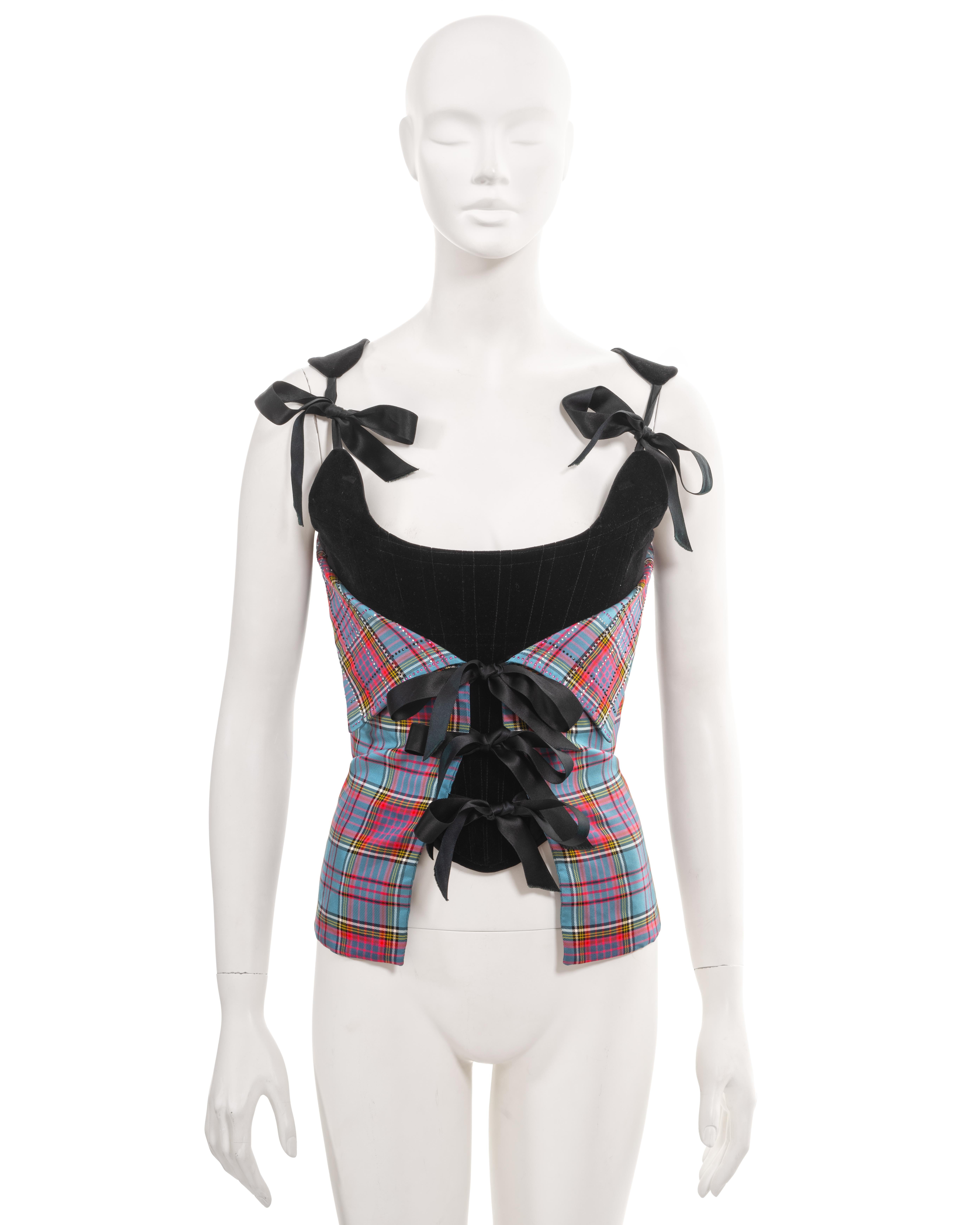▪ Archival Vivienne Westwood corset 
▪ Fall-Winter 1993
▪ Sold by One of a Kind Archive
▪ Black velvet stomacher and back piece
▪ Black power-mesh corset bodice 
▪ Signature MacAndreas tartan silk overlay with the collar adorned with crystals