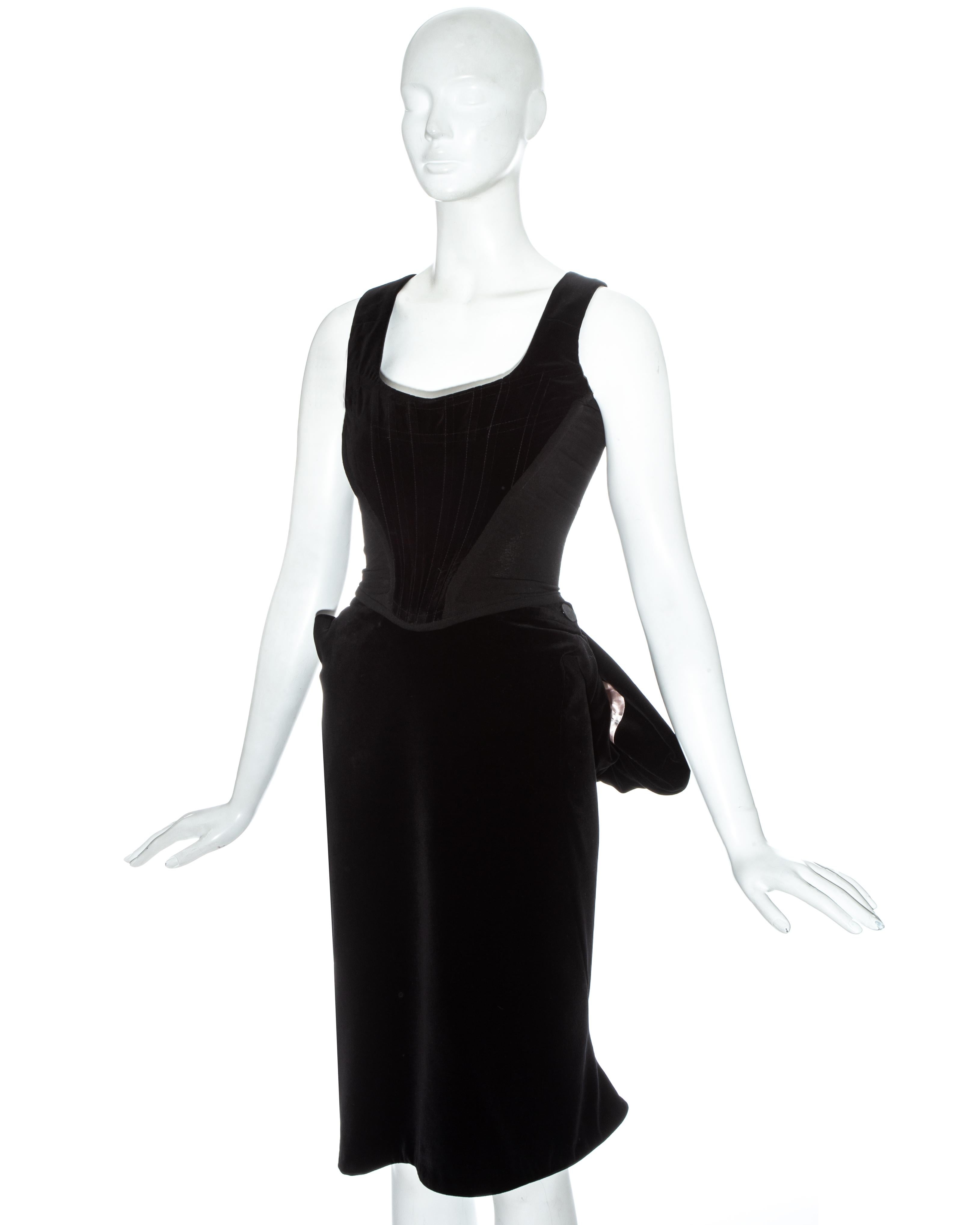 Vivienne Westwood black velvet evening corset and bustled skirt ensemble

Fall-Winter 1996