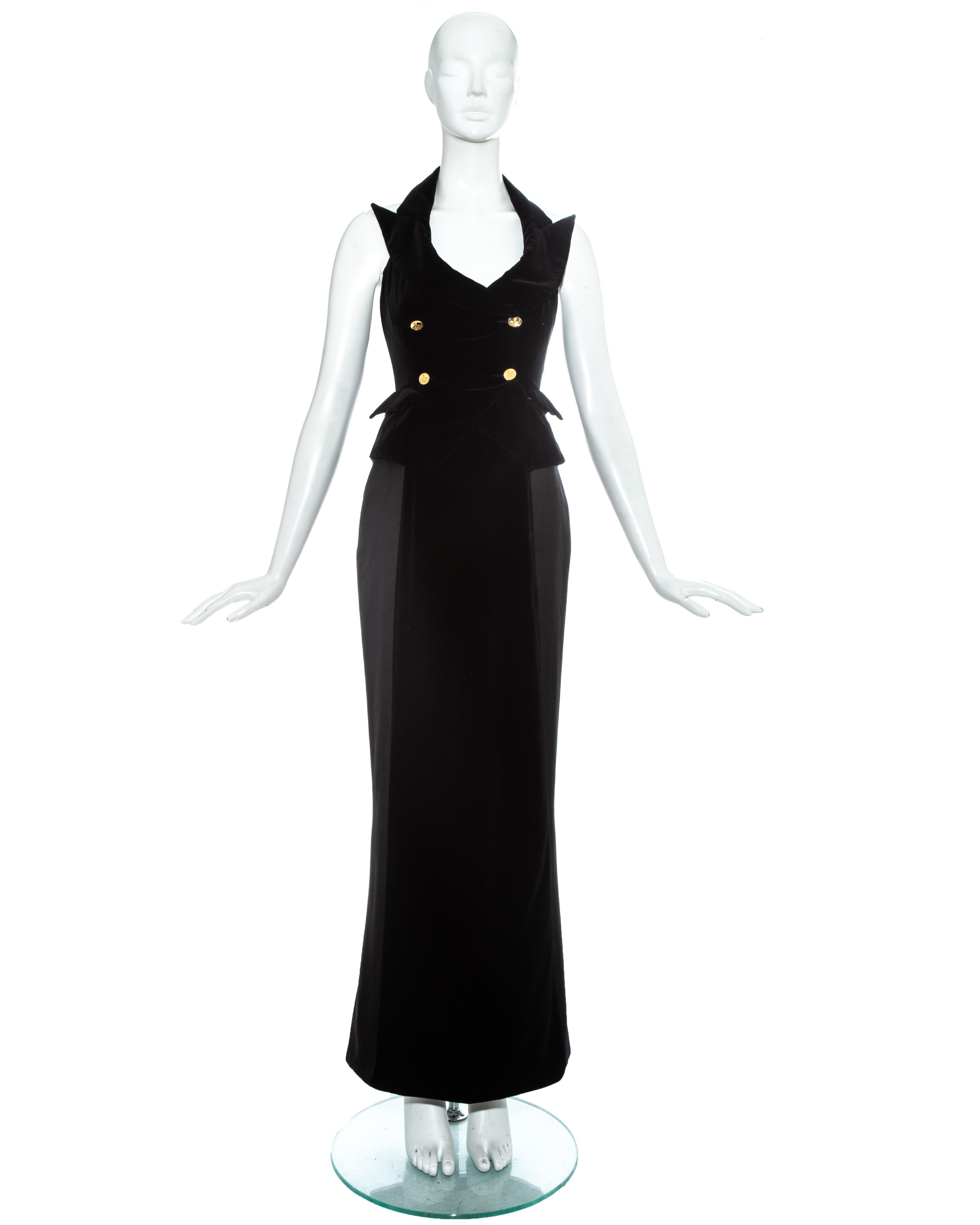 Vivienne Westwood black velvet evening ensemble. Halter neck double breasted waistcoat with built in corset and signature gold orb buttons, and fishtail maxi skirt. 

c. 1995-7
