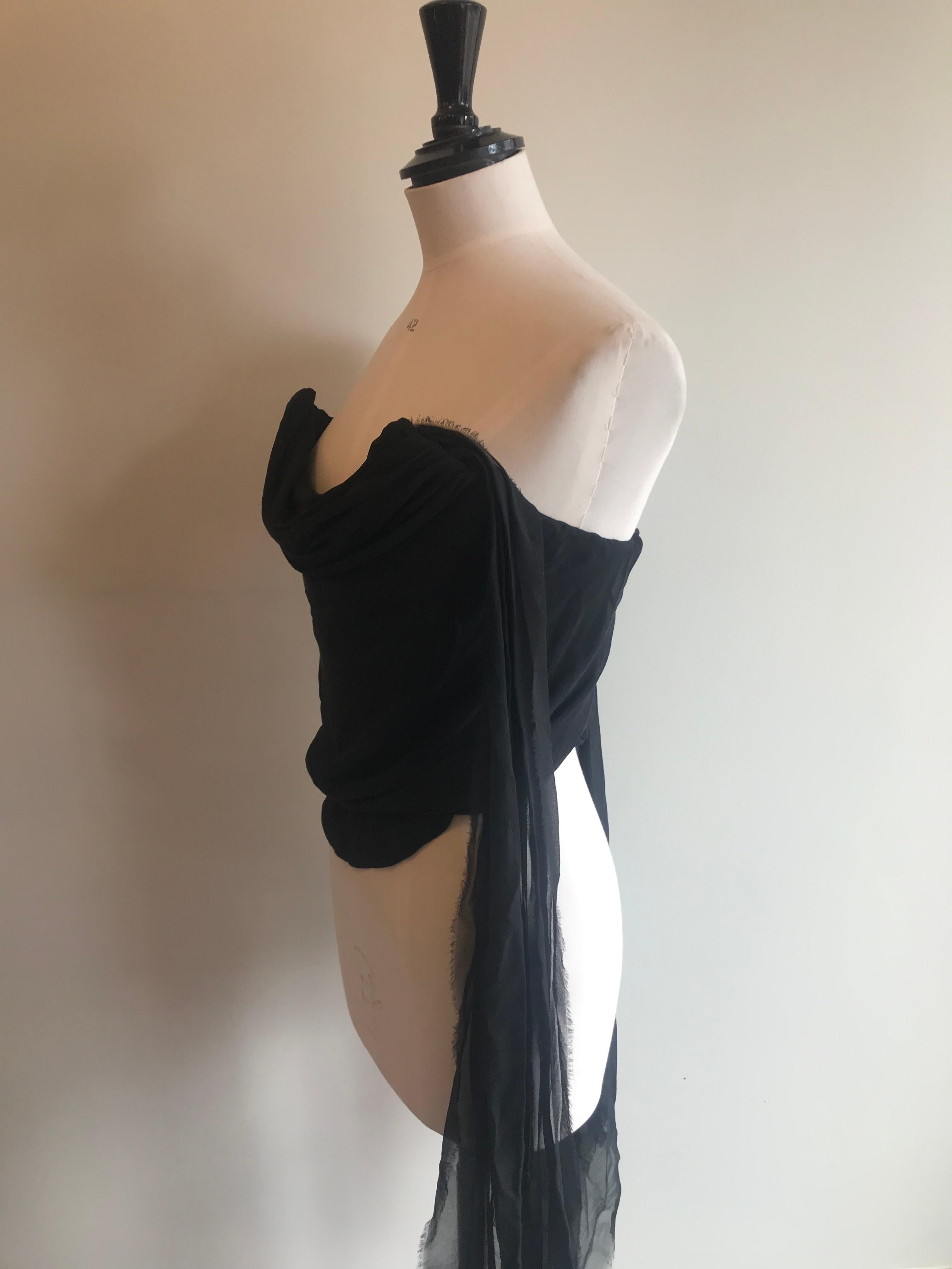 Black silk and chiffon bustier with built in corset with draped chiffon neckline and overlay. Flowing sashes of chiffon hang off the front and back sides which can flow loose or be tied up together. Circa late 1990s. Made in Italy. Marked size 16