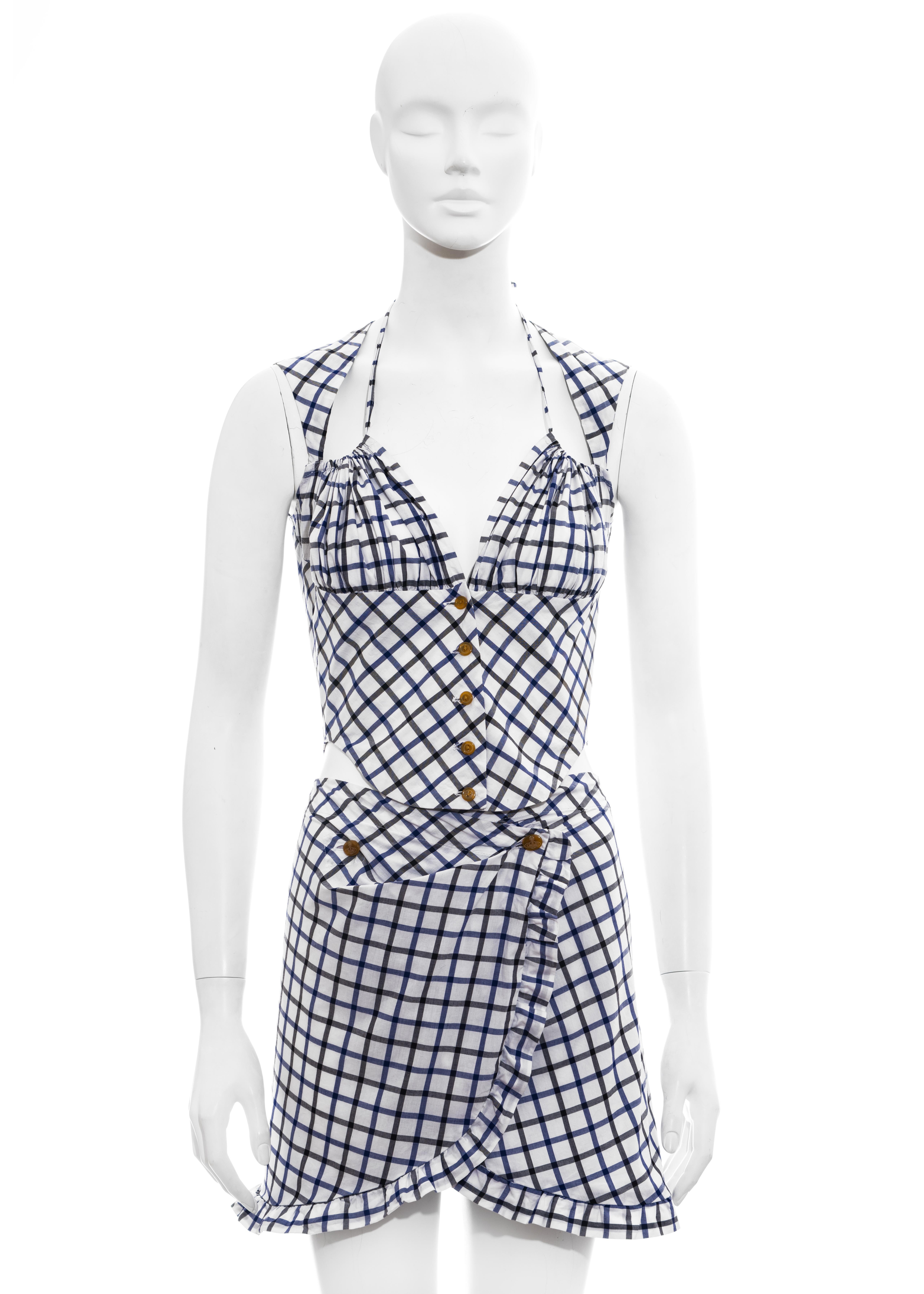 ▪ Vivienne Westwood blue and white checked skirt suit
▪ 100% Cotton
▪ Button-up sleeveless blouse 
▪ Drawstring bra 
▪ Mini wrap skirt with ruffled trim
▪ IT 40 - FR 36 - UK 8 - US 4
▪ Spring-Summer 1994