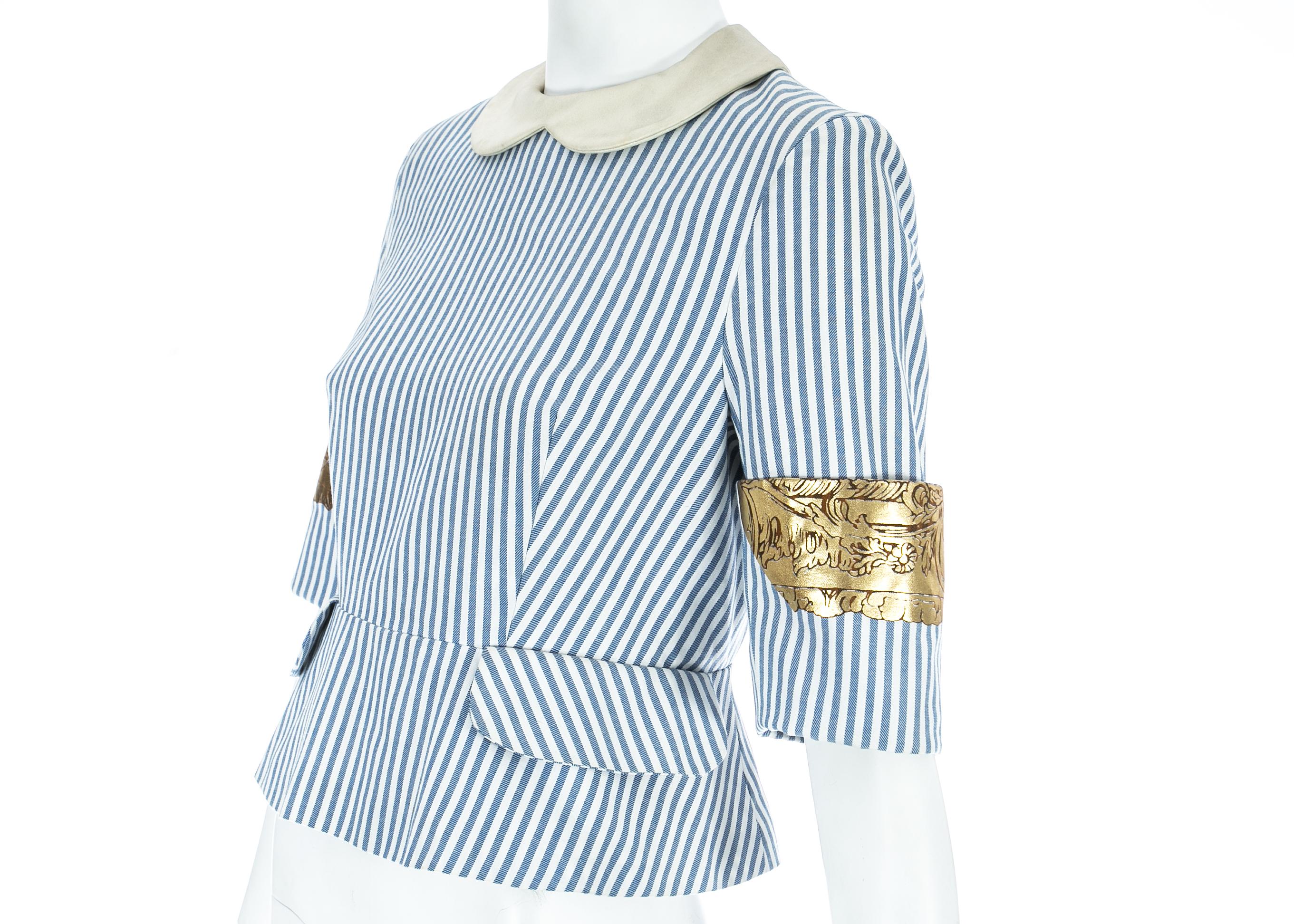 Vivienne Westwood blue and white striped back to front blouse with metallic gold motifs on the cuffs

Spring-Summer 1989