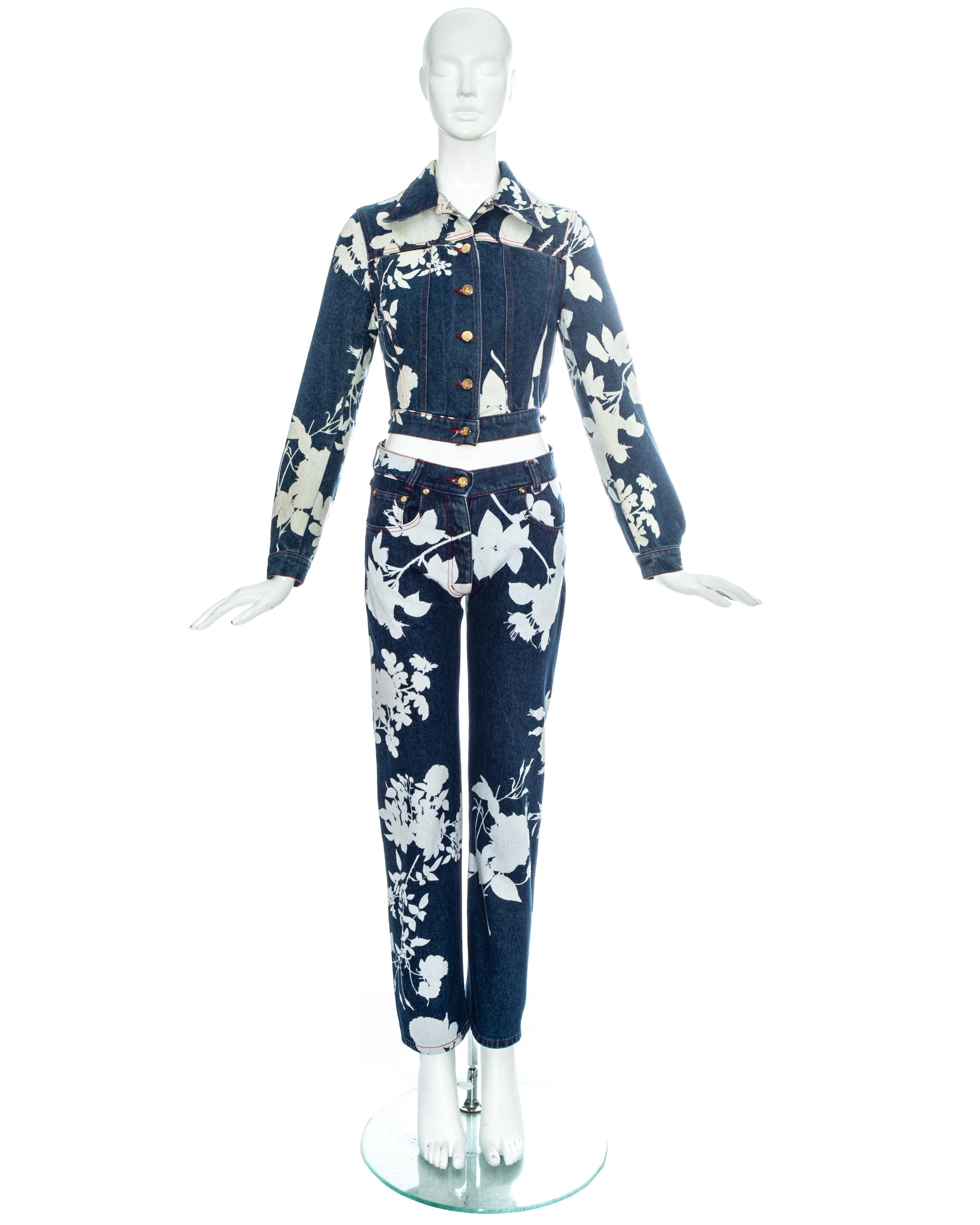 Vivienne Westwood blue denim pant suit with bleached abstract floral print. Fitted cropped denim jacket and high waisted slim fit jeans.

'Cafe Society', Spring-Summer 1994