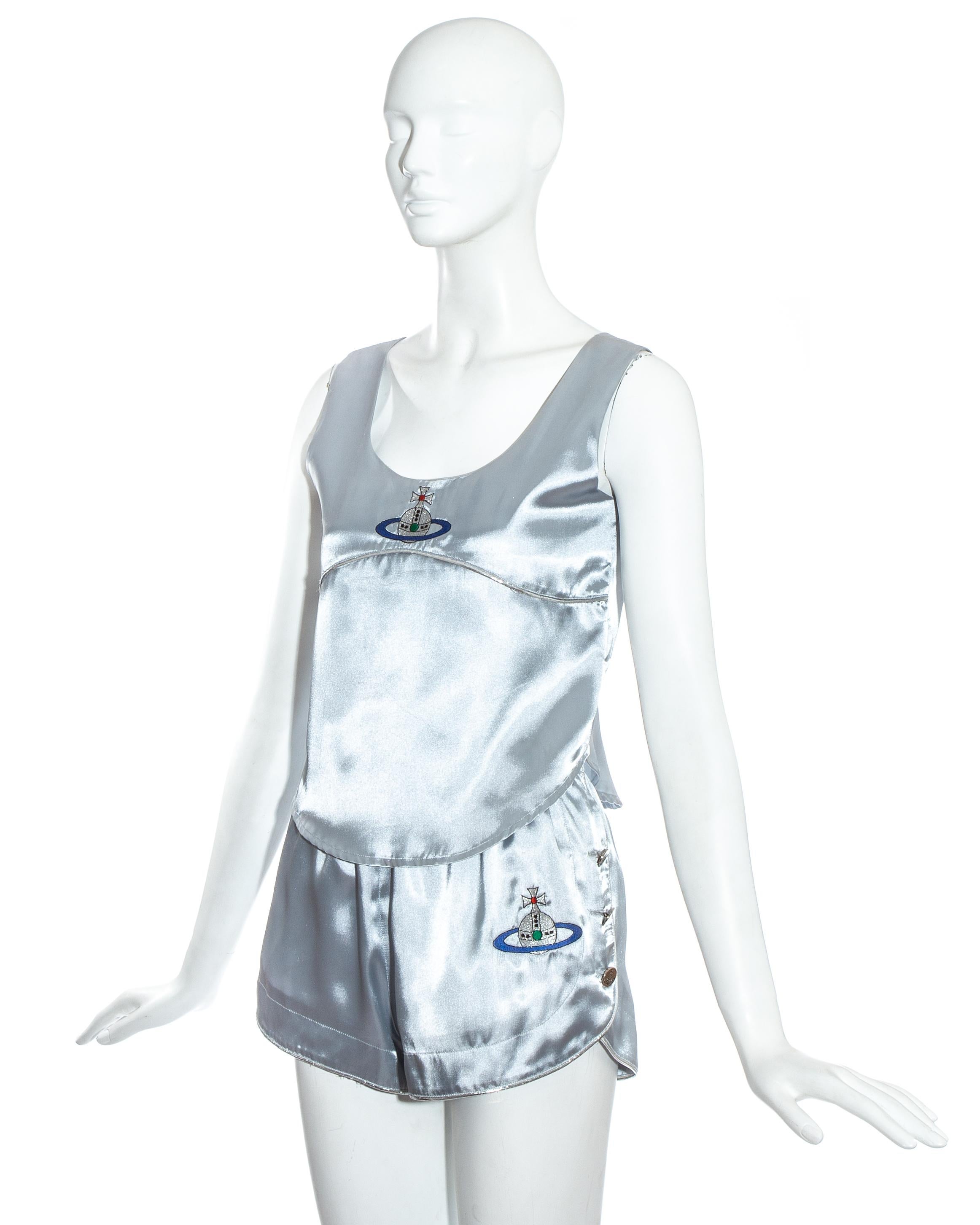 Vivienne Westwood blue satin boxing mini shorts and vest with embroidered orb and signature Westwood silver buttons.

Spring-Summer 1993