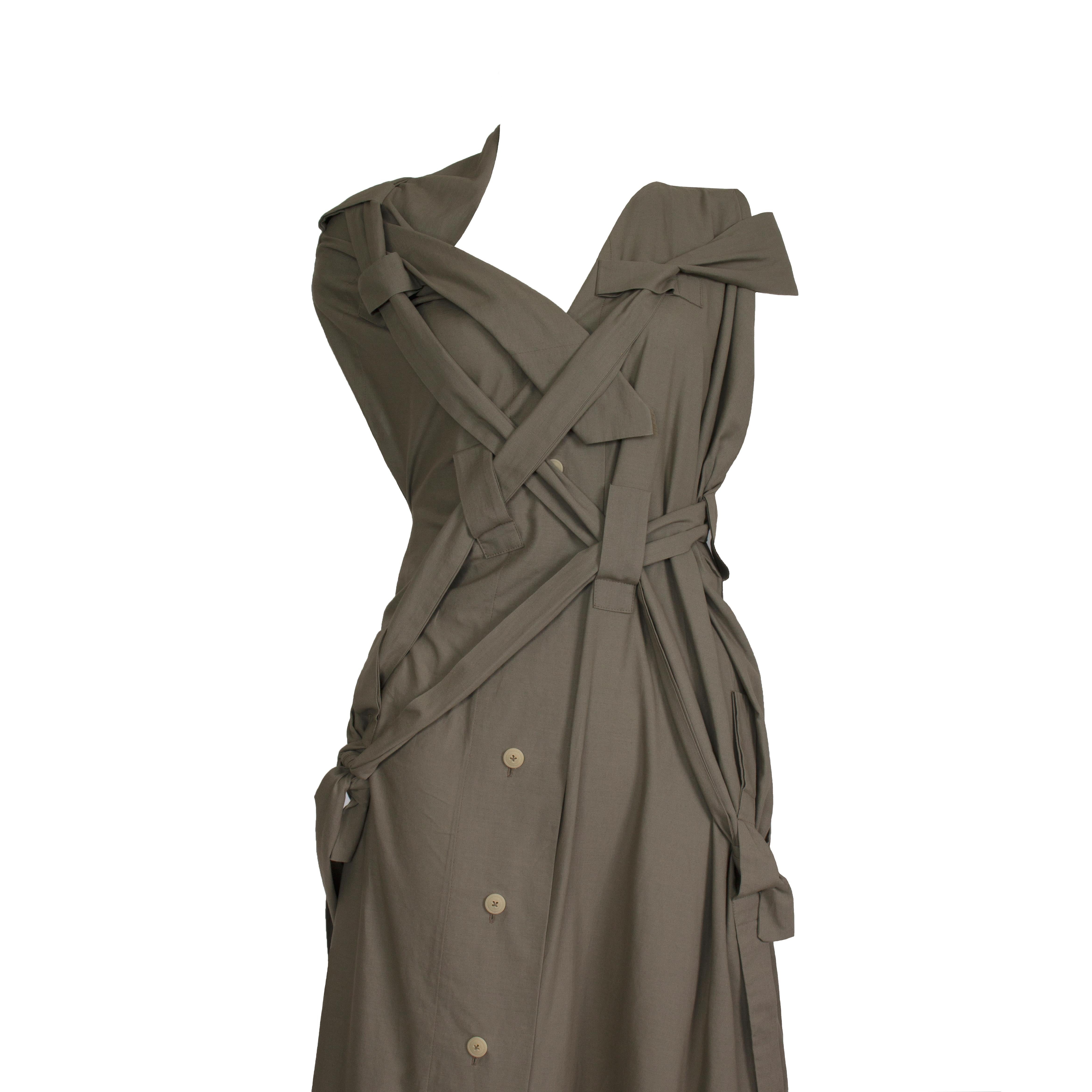 Vivienne Westwood - Gold Label - ‘Bondage’ Dress  -  Asymmetric Shoulder Detail - Strap & Tie Details Throughout Back + Front Dress -  Front Button Fasten - x 2 Side Pockets
Label: Vivienne Westwood - Gold Label
Fabric Content: 100% Cotton - Khaki