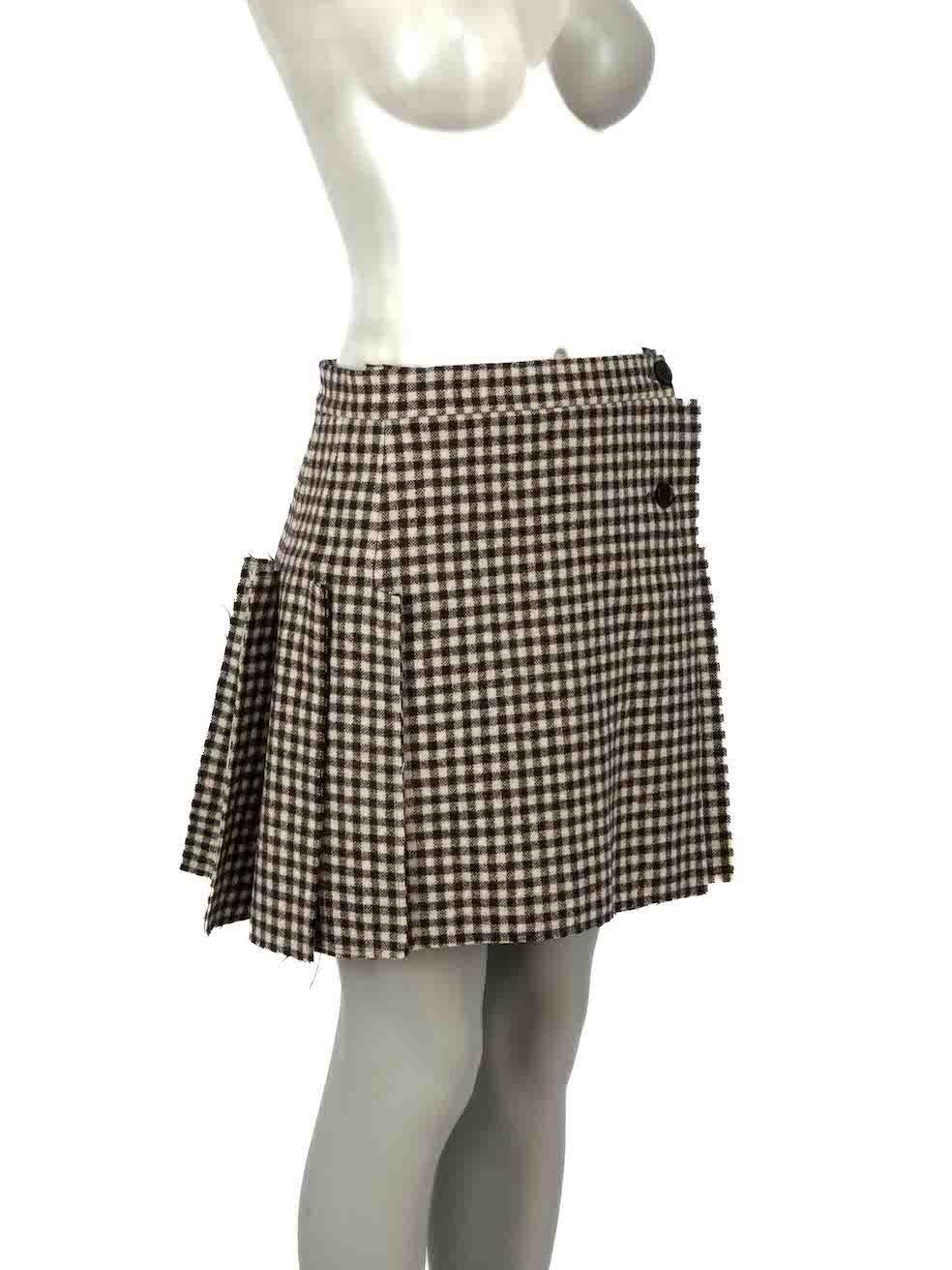 CONDITION is Very good. Hardly any visible wear to skirt is evident on this used Vivienne Westwood designer resale item. Please note that the edges of skirt are deliberately frayed.

Details
Brown
Wool
Wrap skirt
Mini
Gingham pattern
Raw hem
