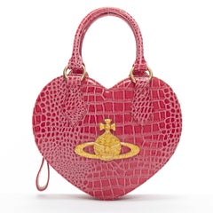 VIVIENNE WESTWOOD Chancery Heart gold orb pink embossed leather bag