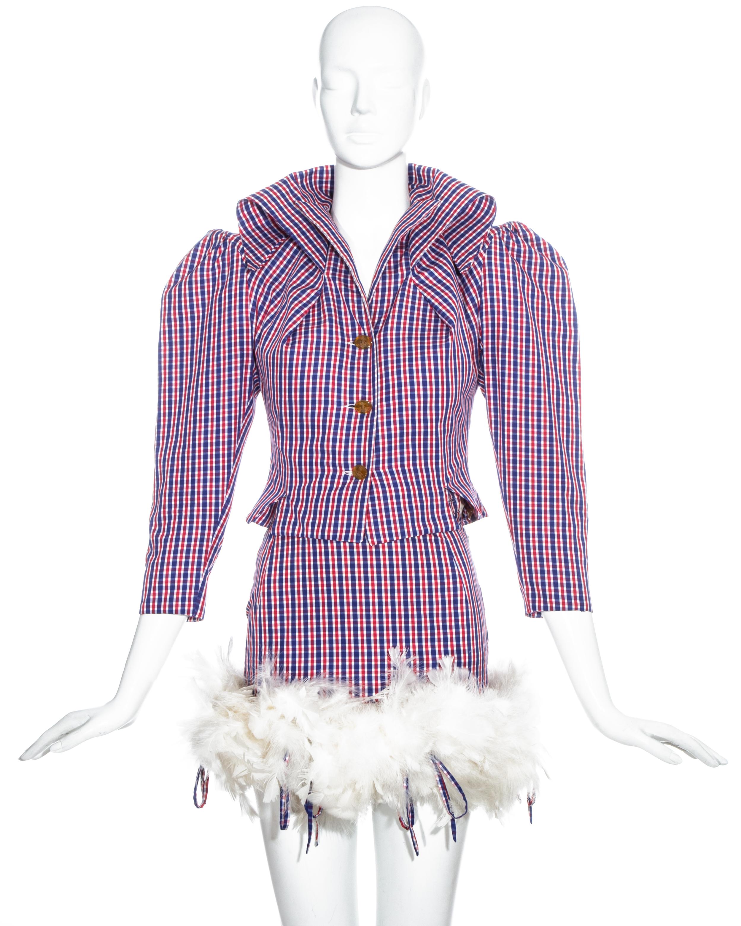 Vivienne Westwood checked cotton 'Cafe Society' skirt suit comprising: fitted jacket with large shoulder pads, extra long collar and orb button closures. Micro mini skirt with feathered hem attached with long string fastenings. 

Spring-Summer 1994