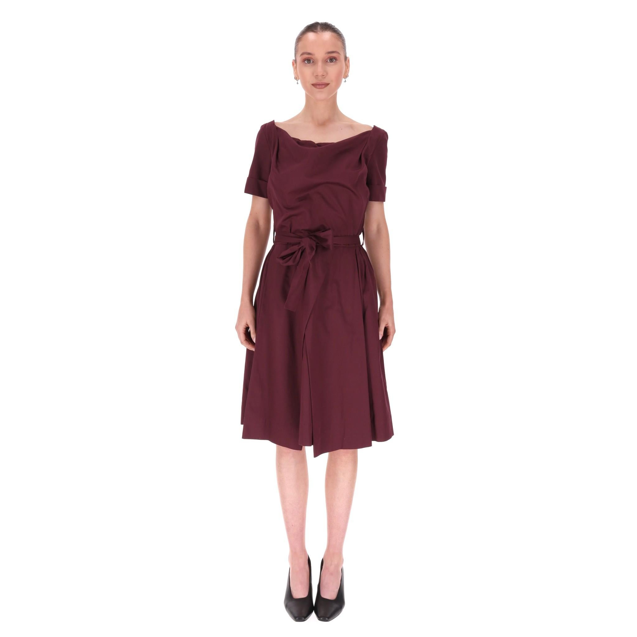 Vivienne Westwood Cotton Belted A-Line Dress

Burgundy dress designed with self-tie belted waist and boat neckline with short sleeves.

Featuring wrap, pleated skirt, round-neck and zip closure to rear.

Rrp Approx. £450

Size – 42FR 

Condition –